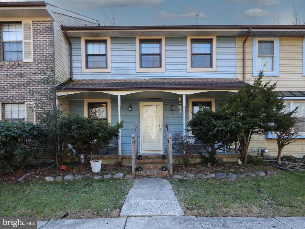 Welcome to this beautifully maintained 3-bedroom, 2.5-bath townhome nestled in a quiet, serene community in desirable Medford, NJ. Original hardwood floors flow throughout much of the home, adding warmth and character to the inviting living room and the step-down family room—perfect for both relaxing and entertaining. The thoughtfully designed layout offers comfortable living and seamless flow from room to room.The spacious primary suite serves as a private retreat, complete with a walk-in closet and an ensuite bath. Enjoy outdoor living from the charming front porch, as well as the screened-in porch—ideal for laughter-filled gatherings and relaxed summer evenings. Just beyond, a deck off the screened-in porch overlooks a tranquil wooded setting with a gently flowing stream, creating the perfect backdrop for barbecues or quiet mornings with coffee.Conveniently located near shopping, dining, and major roadways, this home offers the perfect blend of privacy, comfort, and accessibility.