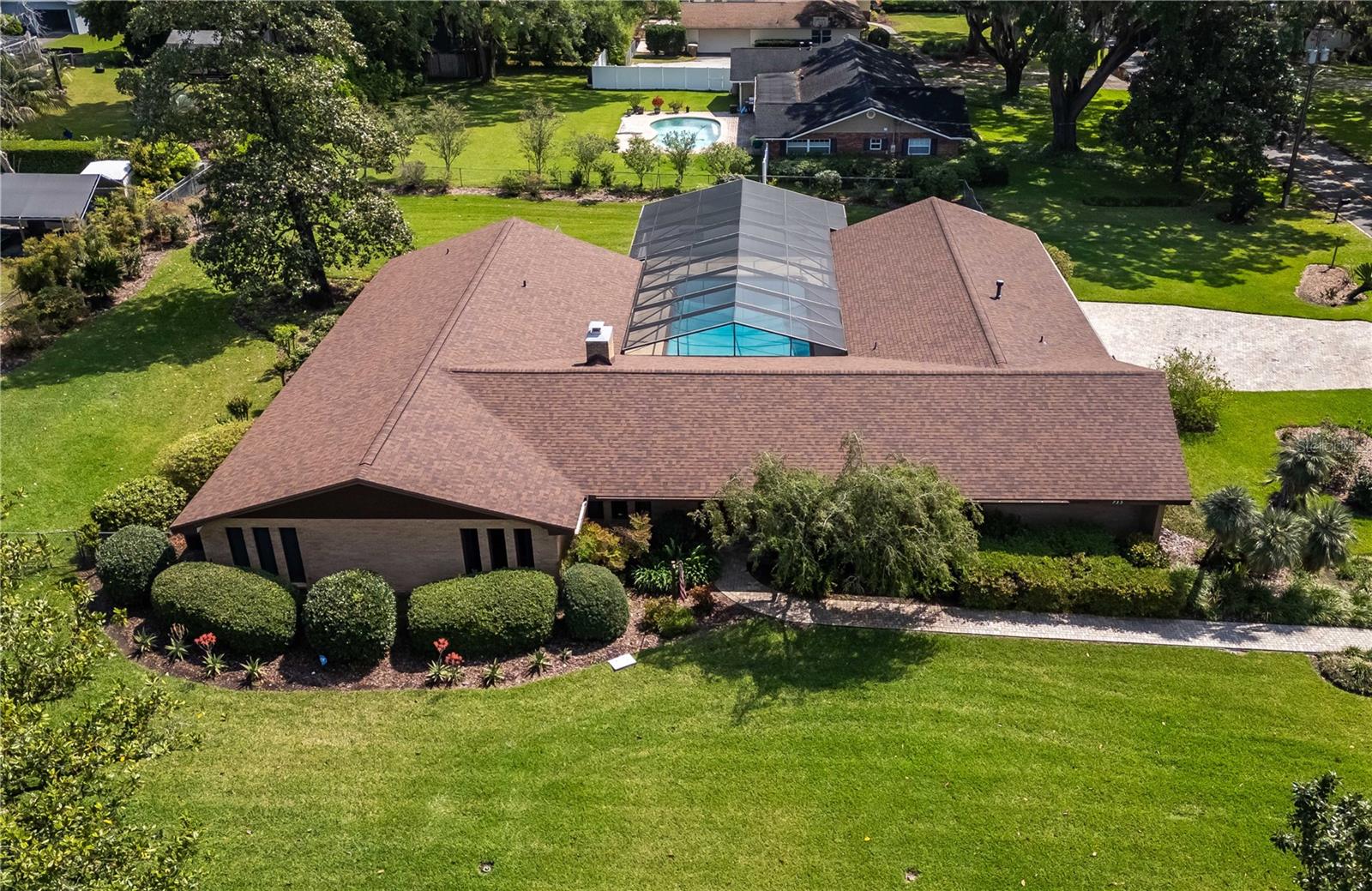 One or more photo(s) has been virtually staged. Perfectly located within the highly sought-after Woodfields neighborhood on an oversized corner lot, this well-maintained home provides easy access to historic Downtown Ocala. Surrounded by tasteful mature landscaping, brick paver walkways and driveways, the home exudes curb appeal from every angle. The custom, solidly constructed single owner residence spans over 4,100 square feet, featuring 5 bedrooms and 3 full baths with a thoughtfully designed split-bedroom floor plan, a game room large enough for a regulation pool table, a 20’ x 40' in-ground pool with a full screen enclosure, a large pool deck, and covered areas that provide plenty of shade to enjoy the year-round sunshine in comfort. This home is perfect for entertaining inside and out. A variety of recent updates have been made throughout, including the roof, an AC unit, and pool Marcite, pool deck and screens for the entire pool enclosure. Additional highlights include the substantial side-street entry 3-car garage, a spacious fenced-in backyard, 2 AC units, 2 hot water heaters, and separate well & pump for irrigation. Woodfields is renowned for its close proximity to an abundance of Ocala amenities, including a variety of shopping, dining, and entertainment options and multiple medical facilities. Golf carts are a popular sight within the neighborhood, offering a unique blend of leisurely living and community charm. This property is zoned for Eighth Street Elementary, Osceola Middle School, and Forest High School, which are 5, 6, and 10 minute drives respectively from the property. Detailed records of the home's construction materials and the original floor plan are readily available, further underscoring the property’s exceptional opportunity!