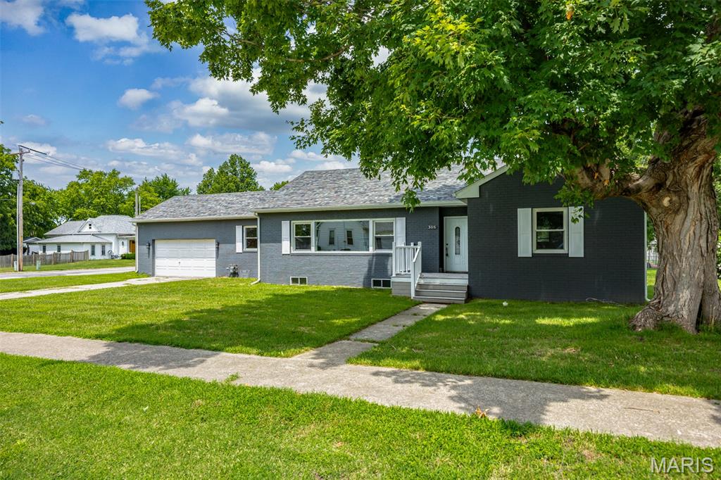 Stylish and bright, this home feels just right! Welcome to this stunning, completely remodeled 4-bedroom, 3.5-bath home that perfectly blends modern updates with timeless charm. From the moment you step inside, you’ll notice the attention to detail and quality finishes throughout. You can't miss the beautifully updated kitchen featuring granite countertops, stainless steel appliances, and ample cabinetry—perfect for both everyday living and entertaining. The spacious living room offers gleaming hardwood floors and a cozy fireplace, creating a warm and inviting space to relax or host guests. The primary bedroom is a true retreat with a luxurious en suite bath, highlighted by a gorgeous walk-in shower. The second and third bedrooms share a well-designed Jack-and-Jill bathroom, ideal for families or guests. A convenient half bath and laundry room are also located on the main floor for added functionality. Enjoy meals in the separate dining area or step outside to the expansive back deck—great for outdoor dining, entertaining, or simply enjoying the outdoors. Downstairs, the partially finished basement offers even more flexibility with epoxied floors, a full bathroom, and two additional rooms perfect for storage, a workout space, or a home office. This home truly has it all—stylish updates, a thoughtful layout, and plenty of room to grow. Don’t miss your chance to own this move-in ready home!