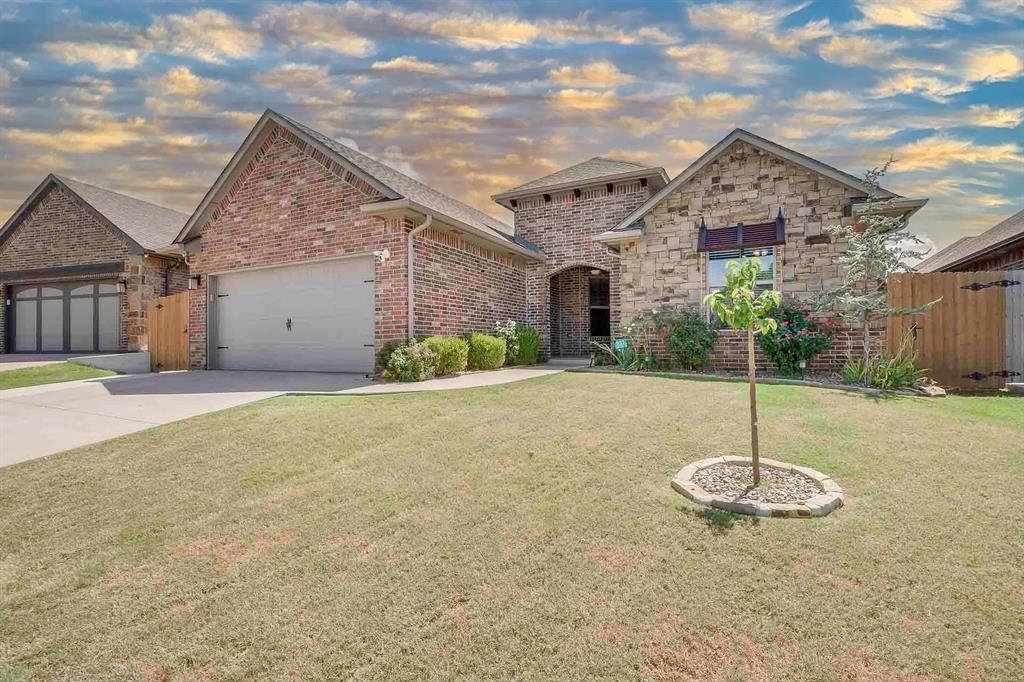 Welcome to 928 NW 191st Street, an immaculate one-story home in The Rush Brook addition of Edmond. Offering 3 bedrooms, 2 bathrooms, and a dedicated study or flex space across 1,716 sq ft, this home was designed with both comfort and functionality in mind. Inside, you’ll find brand-new carpet, fresh interior paint, and 3 cm granite countertops paired with rich mahogany-stained pine cabinets and stainless steel appliances. The open-concept kitchen flows seamlessly into the main living area with a cozy fireplace and mantel, making it the perfect gathering space for family and friends. The Primary suite is tucked away for privacy and features dual vanities, a Jetted tub, and a spacious walk-in closet with a built in dressing mirror.. This home also comes fully equipped with upgrades you won’t often find: a below-ground storm shelter, a whole-home Generac generator, newly installed solar panels, and an alarm system with security cameras. Outside, enjoy a covered patio overlooking the beautifully landscaped backyard, extended concrete along the east side as well as extra patio space, crushed gravel along the west side, and French drains that carry water to the street. The backyard is fully fenced, and the garage provides extra storage. All of this, plus a prime location just minutes from shopping, dining, and entertainment, within the top-rated Edmond School District. Move-in ready and offering unmatched peace of mind. Rush Brook offers amenities such as a playground and a community pool with a splash pad.