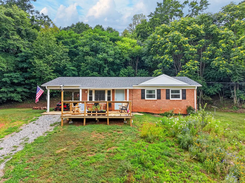 Welcome to this beautifully remodeled 3-bedroom, 2-bath home sitting on over 5 acres. Offering the perfect blend of modern comfort and peaceful country living. Nearly every detail has been updated, including new plumbing, electrical, flooring, appliances, and more, while the refinished original hardwood floors add timeless warmth and character. The open, inviting layout flows effortlessly to a spacious new deck, creating the perfect place to relax, entertain, or enjoy the sights and sounds of nature. Surrounded by mature trees, this property offers exceptional privacy while remaining minutes from downtown Stuart, shopping, dining, and everyday conveniences. Outdoor enthusiasts will appreciate the close proximity to Fairy Stone State Park, the Blue Ridge Parkway, local wineries, hiking, fishing, and endless mountain recreation. If you've been searching for a move-in-ready home with acreage, tranquility, and convenience, this Blue Ridge Mountain retreat is one you won't want to miss.