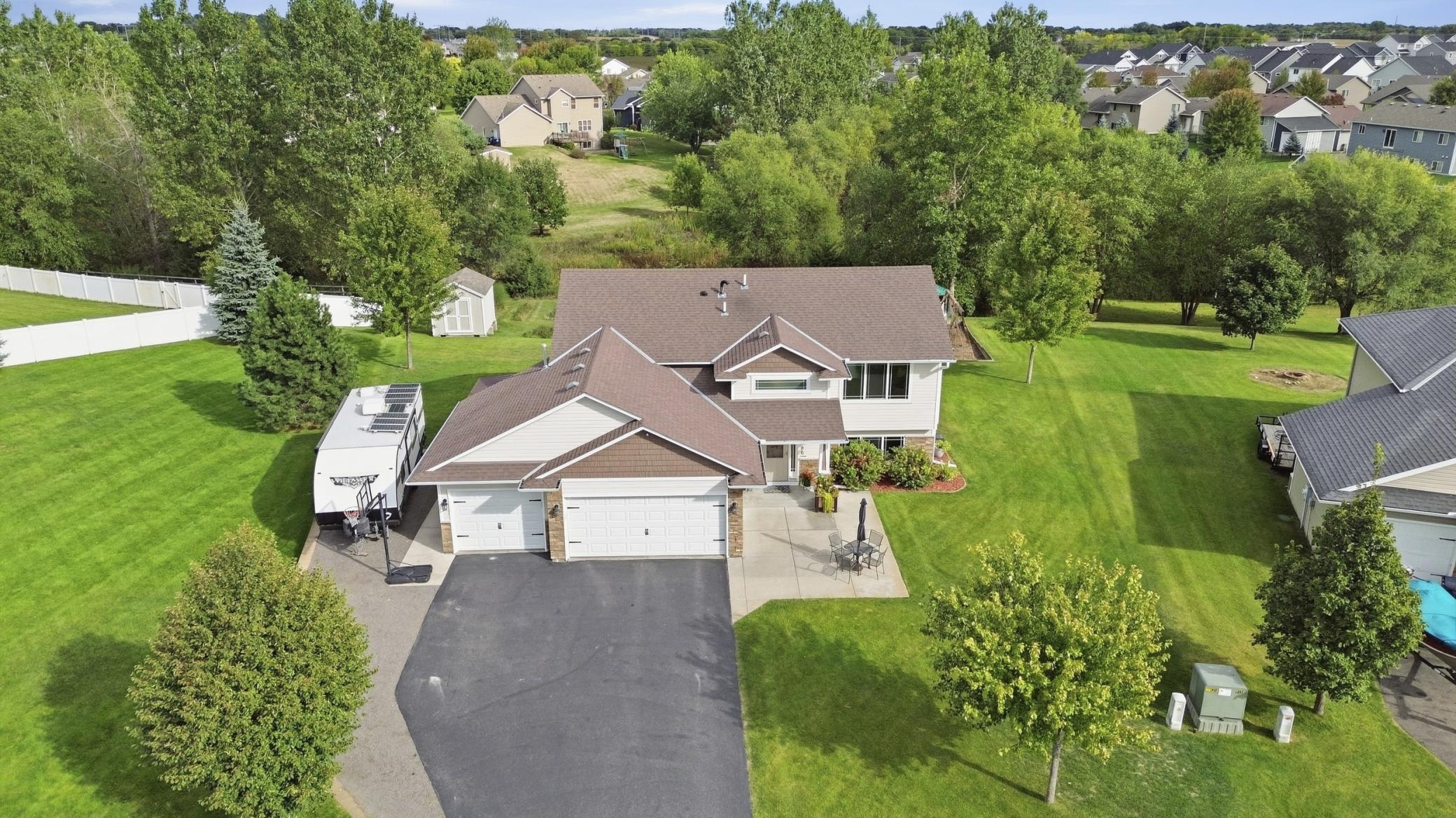 Check your wish list, it's all here!With a neighborhood park just steps away, a heated 3-car garage, brand new flooring and paint, and an indoor electric sauna, this 2013 built home brings a lot more to the table than meets the eye. Offering over 2,400 FSF, 5 beds, and 3 baths, this home is full of those great extras that really make a house a home.The main level features vaulted ceilings, a bright open-concept that keeps everyone connected while cooking breakfast or helping with homework, and a kitchen boasting a two-tiered center island, kitchen window, stainless steel appliances, a very handy kick-vac, plus a nearby hallway pantry. The primary suite offers a walk-in closet with built-in organizers and a private 3/4 bath, while the additional upper-level bedrooms also feature built-in organizers in the closets.  Brand new carpet throughout the upper level adds warmth and comfort.The finished lower level adds even more living space, including two bedrooms, a family room, a spacious finished laundry room with built-in cabinets for plenty of storage and workspace, an electric sauna that feels like your own private escape at the end of a long day (which is accompanied by a beautiful 3/4 bath with tiled shower)Step outside and the appeal continues with a spacious 22x14 deck, covered front porch, a concrete patio that's perfect for extra seating or gathering around a table, and a covered patio area off the garage. The backyard includes a dedicated play area, playset, and storage shed, while the sprinkler system keeps the grass looking lush and green. The outdoor spaces offer something for everyone!And then there's the garage, a true standout. This attached 3-car is fully finished, heated, insulated, and equipped with plenty of built-in storage solutions. Plus, it offers additional gravel parking alongside for your boat or camper. An asphalt driveway completes this deluxe setup.Don't miss the one that has it all!