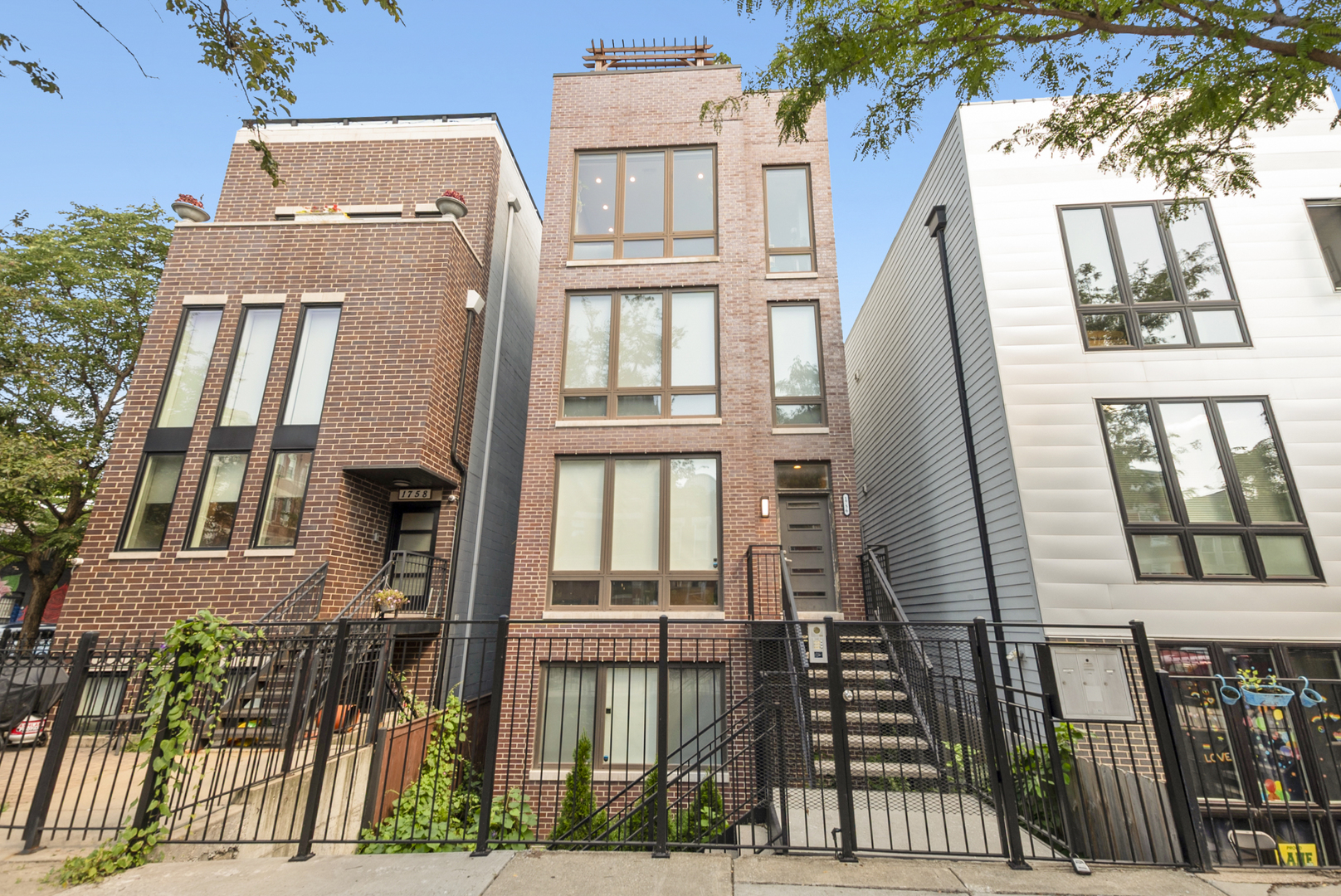 Welcome to 1756 W. Cullerton Street, an exquisite 2 bedroom, 2 bath penthouse condo located in Chicago's beloved Pilsen neighborhood. Originally constructed in 2020, this third floor unit features top of the line luxury finishes throughout over 1,250 square feet of smartly-designed living space. The modern kitchen and living area are spacious and inviting, with an idyllic Southern exposure providing consistent natural sunlight and warmth throughout the day. The beautiful floor to ceiling windows not only illuminate the space with natural light, but are also outfitted with custom remote-operated shades for easy control and privacy. The built-in electric fireplace sets the vibe with a simple click of a button, the perfect way to elevate the atmosphere while entertaining or simply cozying up on a chilly night. The kitchen is a culinary dream, featuring gorgeous flat-panel cabinetry and quartz countertops, custom tile backsplash, under-cabinet lighting, high-end stainless steel appliances, and peninsula. If desired, the main living area is spacious enough for a dedicated dining area/banquette for additional seating. Beautiful hardwood floors flow from the living room and kitchen down the hallway leading to the 2nd bedroom, an elegant full guest bath, and finally to the primary suite, featuring a walk-in closet and spa-like bath with a dual vanity and marble walk-in shower with rain shower head. Through the rear exit of the unit is a lovely deck perfect for stepping out to enjoy your morning coffee, one of two private outdoor spaces. The very best is saved for last as you travel up to your stunning, private rooftop terrace, the ultimate outdoor retreat for year-round enjoyment. No detail was spared in the creation of this urban oasis, complete with maintenance free Timber Tech composite flooring, a Pergola to relax under, and generous space for gardening, outdoor dining and entertaining, all while taking in sweeping skyline views. Additional notable features/improvements include: 4 inch recessed lighting, touch sensor dimmer lights, touch sensor mirror lighting in bathrooms, spray foam insulation for sound proofing, video intercom, tankless water heater, new storm doors, secure entries in both front and rear with faab and code access, all new exterior lighting, and newly painted/finished front and rear stairwell gates. Take in all that the culturally vibrant Pilsen community has to offer, from the collection of dozens of brilliant public murals and The Mexican Museum Of Art, to the celebrated culinary scene with local favorites including Carnitas Uruapan, 5 Rabanitos, and Novel Pizza Cafe... all steps from your front door! Extremely commuter friendly location within minutes to public transportation (18th Street, Pink Line, I-55, I-90) and shopping (Aldi, Costco, Jewel). This unit checks every box... refined modernity coupled with comfort and function, creating a home that feels both curated and effortless. One of the best values in Pilsen!
