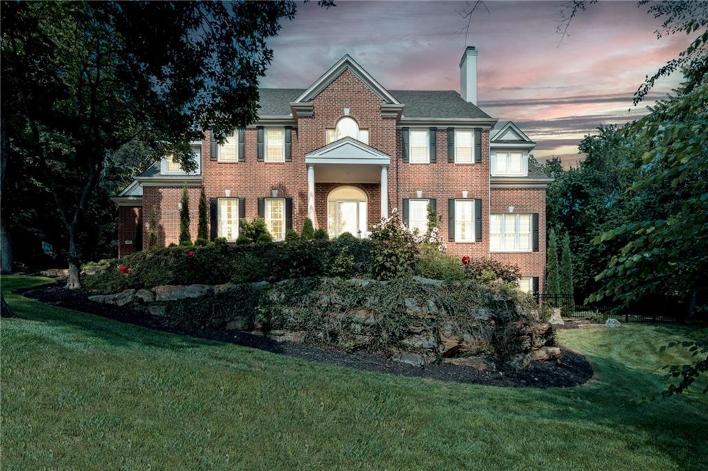 Tucked behind the gates of Loch Lloyd, this is more than a home, it’s a private retreat designed for the way you want to live.Set on a secluded, tree-lined estate, this residence offers the rare combination of timeless architecture and resort-style living. From the moment you arrive, you’re welcomed by a sense of space, privacy, and quiet luxury that’s increasingly hard to find.Inside, expansive living areas are designed for both everyday comfort and unforgettable entertaining. Sunlight pours through oversized windows, highlighting rich architectural details, while multiple gathering spaces create a natural flow for hosting on any scale. This home offers a beautiful rotunda upon entry, columns & Italian imported marble floors. Wine cellar off dining room, fabulous sunroom with lake views, and a window-lined kitchen that is perfect for entertaining. The heart of the home invites connection, whether it’s intimate dinners, holiday celebrations, or evenings that linger a little longer than planned.Downstairs, a fully finished lower-level transforms into an entertainer’s dream. Featuring a custom English-imported pub bar and generous recreation space, it’s the perfect setting for hosting, unwinding, and creating experiences your guests won’t forget.Step outside and the lifestyle continues. The private grounds offer space to relax, play, and recharge, complete with lake views, a sport court and room to design your own outdoor oasis.This is a home for those who value privacy, presence, and the ability to live beautifully, both inside and out.Living in Loch Lloyd means enjoying world-class amenities including gated security, championship golf, clubhouse dining, fitness facilities, pickleball and tennis, scenic walking areas, and a beautiful lake. All just minutes from south Kansas City, Leawood, and Overland Park conveniences. A rare opportunity to own a true estate experience in one of Kansas City’s most exclusive gated communities.