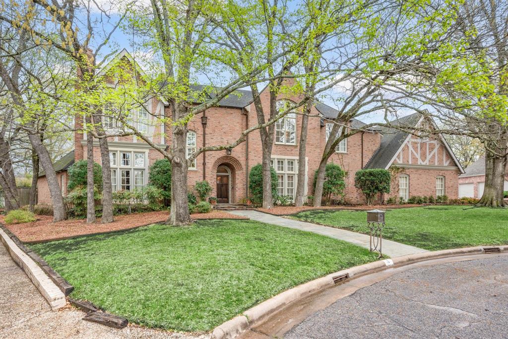 Welcome to a world of timeless elegance with this spectacular English Tudor-style estate, where classic craftsmanship meets contemporary luxury. This truly custom built 4-bedroom, 5-bathroom masterpiece offers an exquisite blend of gracious living spaces, refined details, and high-end finishes. From the moment you arrive, the home’s picturesque timbered façade, steeply pitched roof, and elegant brickwork exude storybook charm. Step inside to discover exposed wood beams, intricate moldings, and beautiful fireplaces, adding warmth and sophistication to every corner.  Designed for the discerning chef, the gourmet kitchen boasts top-of-the-line appliances, custom cabinetry, and a spacious island, ideal for both everyday meals and grand entertaining. The large walk-in wine cellar with a dedicated AC system is waiting to be filled with your favorite wines. The formal dining room, inviting living spaces, and cozy study create an atmosphere of refined comfort.  The primary suite is a sanctuary featuring an ensuite bath with a deep soaking tub, dual vanities, and a walk-in shower. Each additional bedroom is generously sized, offering privacy and comfort for family and guests.  Outside, your private oasis features a sparkling pool, lush landscaping, and an expansive patio set the scene for unforgettable gatherings or tranquil evenings under the stars. The four-car garage provides ample storage and convenience for car enthusiasts or growing families. Tucked away in a serene and sought-after neighborhood, this extraordinary residence offers unmatched charm, elegance, and sophistication. Don't miss the opportunity to make this dream home yours—schedule your private tour today!