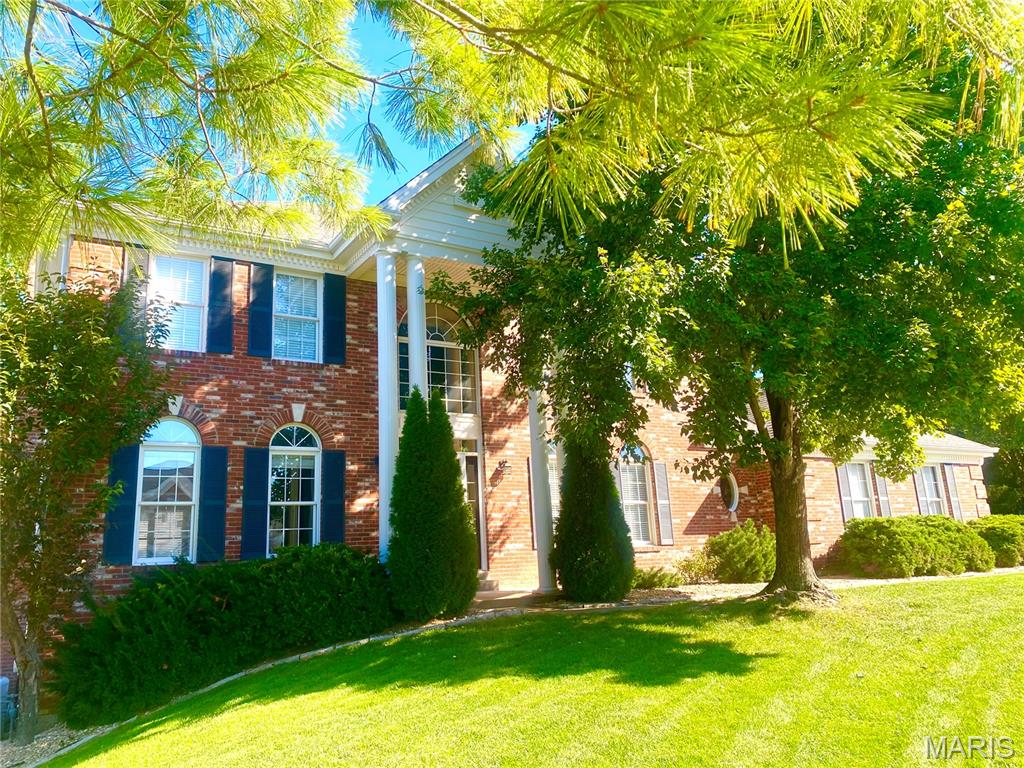 Welcome to this beautiful home in a desirable area of Chesterfield that is within walking distance to great schools, prime shopping at Town & Country Crossing, fun restaurants and close to parks and hospitals too! Tucked away in the Wellington Estates neighborhood, this classic 2 story home has approx 3868 Sq Ft of finished living space including 4+Bedrooms and 4 baths (3/1) .  As you enter the home, you are greeted by the 2 story foyer and the new hardwood floors that were just added to the main level plus new carpet added to the second floor. There is a separate living room and a huge dining room that is perfect for entertaining! The great room has built-in bookshelves surrounding the masonry fireplace and a wet bar. The large eat-in kitchen has 42 inch cabinets, granite countertops, a center island and double ovens, plus it has access to the back deck which makes BBQing easy! There is a main floor laundry adjacent to the kitchen and a planning desk too! Upstairs are the 4 bedrooms including the generous primary bedroom suite which has double sinks, a soaking tub and a separate shower. The walk out lower level includes a large recreation area as well as a bonus room that could be a home office or sleeping area. To top it off, there is a 3 car garage too!