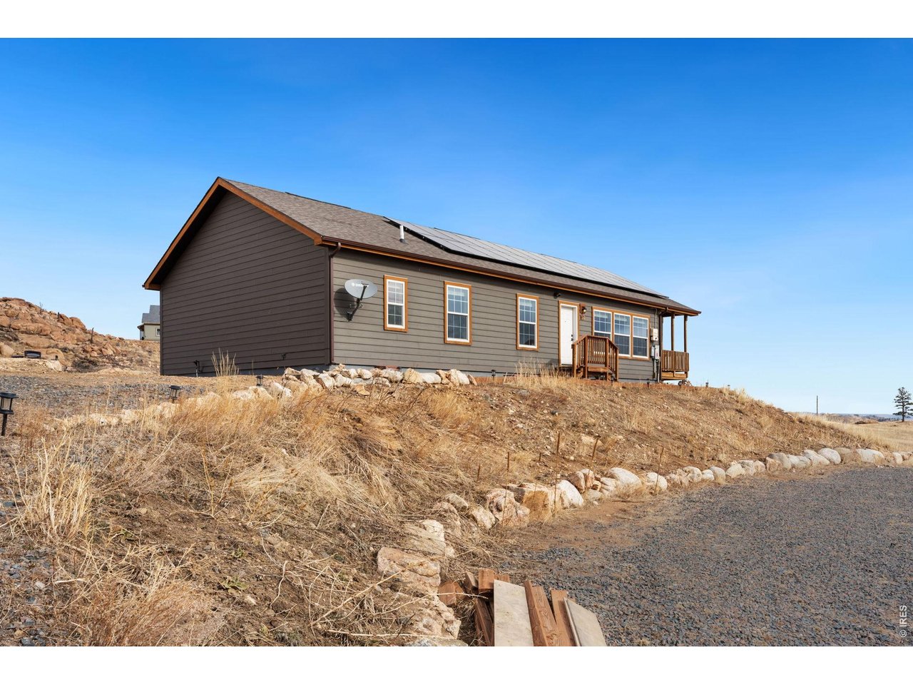 Unbelievable views and stocked fishing ponds! Your dream to own a mountain home in the desired community of Glacier View Meadows awaits! Built in 2019, this 3-bed, 2-bath, 1,640 square foot home, is sitting on 2.4 beautiful acres, surrounded by 360-degree stunning views of the rolling hills and mountains. This home is full of natural light, from it's 9 ft. ceilings, open floor plan, and abundance of windows, there are amazing mountain views from all sides of the home. You won't ever miss a Colorado sunrise or sunset! It is the perfect place for entertaining. The gourmet kitchen offers a large center island, gorgeous knotty pine cabinetry and a gas range/hood. The large primary bedroom is complete with a great size 5-piece bathroom, that includes a double vanity, oversized shower, and large soaking tub. Step out of the dining room to an inviting covered deck to sip your morning coffee and take in the breathtaking views. Sit back and unwind near the outdoor stone fire pit for cozy evenings under the stars. The beauty of this home goes beyond the interior improvements and is enhanced by the beauty of the great outdoors. This property offers some of the best technology for rural mountain living. Starlink high-speed internet, SimpliSafe Security System, and a commercial grade multi-carrier cell signal booster will aid in keeping you connected. This home includes an energy efficient solar system! Enjoy mountain living, private lakes for fishing and lots of hiking trails. Glacier View Meadows is located near the Arapaho/Roosevelt National Forest along the Front Range of the Colorado Rockies, northwest of Fort Collins! Come and check out this amazing property for yourself!