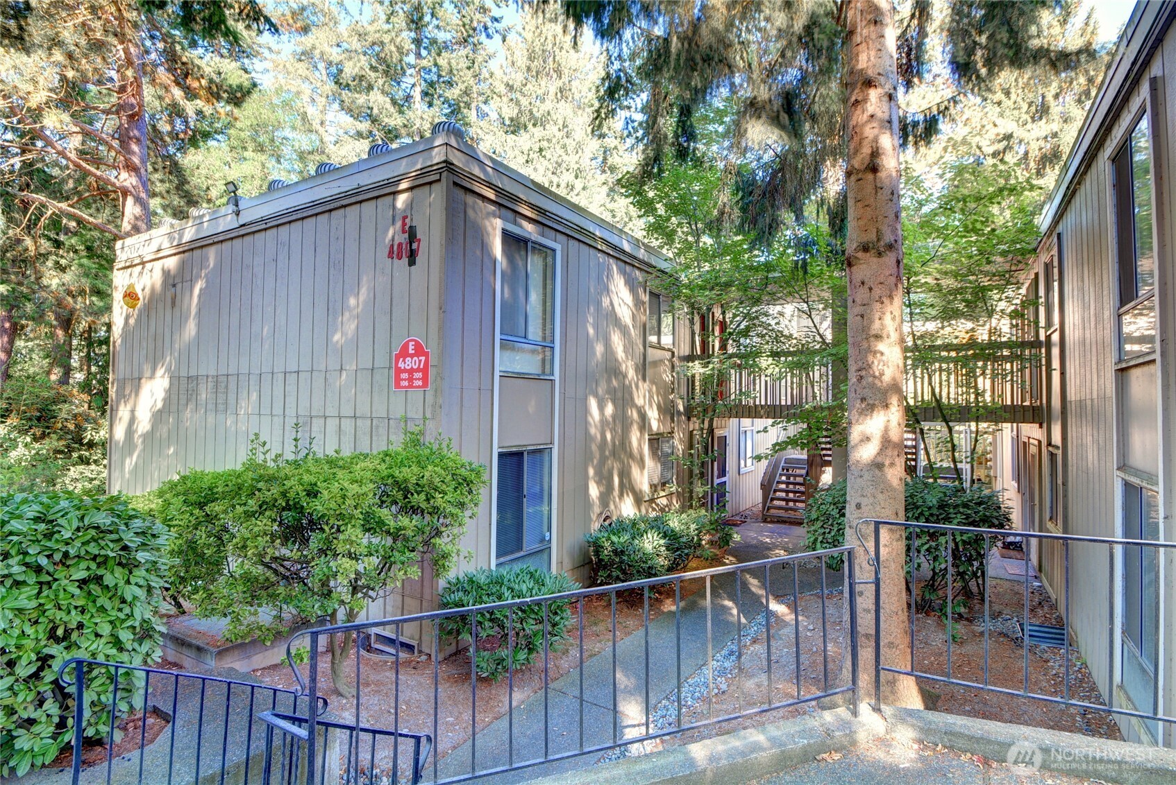 This affordable condo will impress with freshly painted interior and updates throughout. Walk in and you'll appreciate the updated flooring, beautiful kitchen with granite countertops, and spacious great room with lots of room for your living and dining room furniture. There are 2 bedrooms plus the bathroom, also updated with granite slab countertop and new faucet/sink. The private patio, accessible through large sliding doors, also has a storage area and easy access to parking. . Shadow Wood has an outdoor pool, clubhouse and laundry room, easily accessible. This FHA approved condominium is perfect for those desiring location, convenience and access to Transit (2 blocks), Light Rail(1.6 miles), Costco (1.6 miles), and more! HOA Dues cover water, sewer and garbage. Pet rules allow 3 cats/dogs combination.  This is a well run condominium association, with no special assessments, updates made as needed, and with the approval of the Condo Association, a washer/dryer can be placed in this unit.