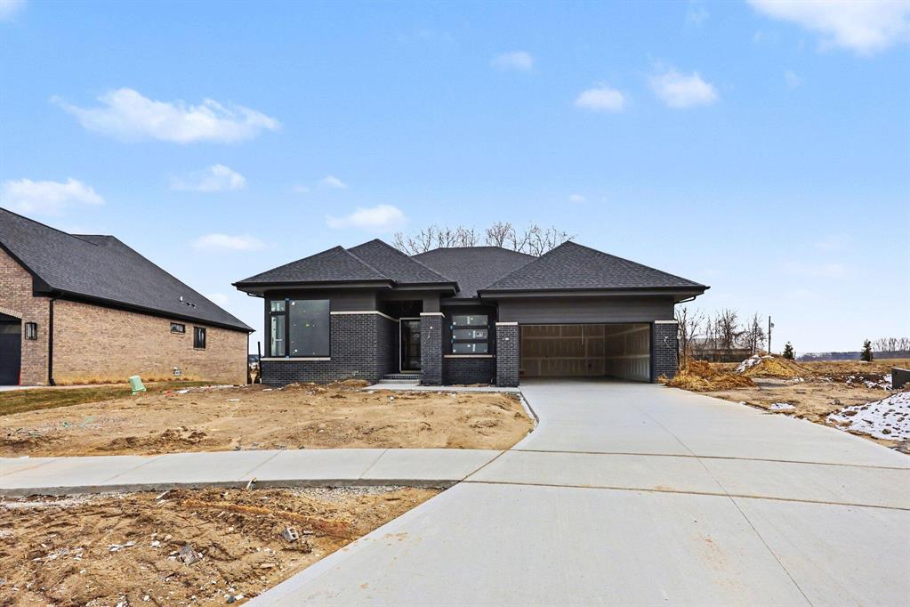 AVAILABLE NOW \ EST. APRIL 2026 COMPLETION. A modified version of the popular ''Kirkwood'' floor plan offering 3 bedrooms, 2.5 baths, and over 2,500 sq ft of finished living space. The home features top-tier finishes throughout, including wood flooring and quartz countertops. The gourmet kitchen includes premium cabinetry, stainless steel appliances, a custom wood hood, and beverage center. Soaring 10' ceilings and 8' interior doors enhance the open feel. The Owner's Suite offers a luxurious bath with his-and-hers vanity, spacious walk-in shower, freestanding tub, and dual walk-in closets. Two additional bedrooms are located on a separate wing and share a Jack-and-Jill bath. Additional highlights include an oversized 2.5-car garage, staircase from the garage to the basement, and a covered patio. Price includes stainless steel kitchen appliances, sod, sprinklers, and front landscaping.