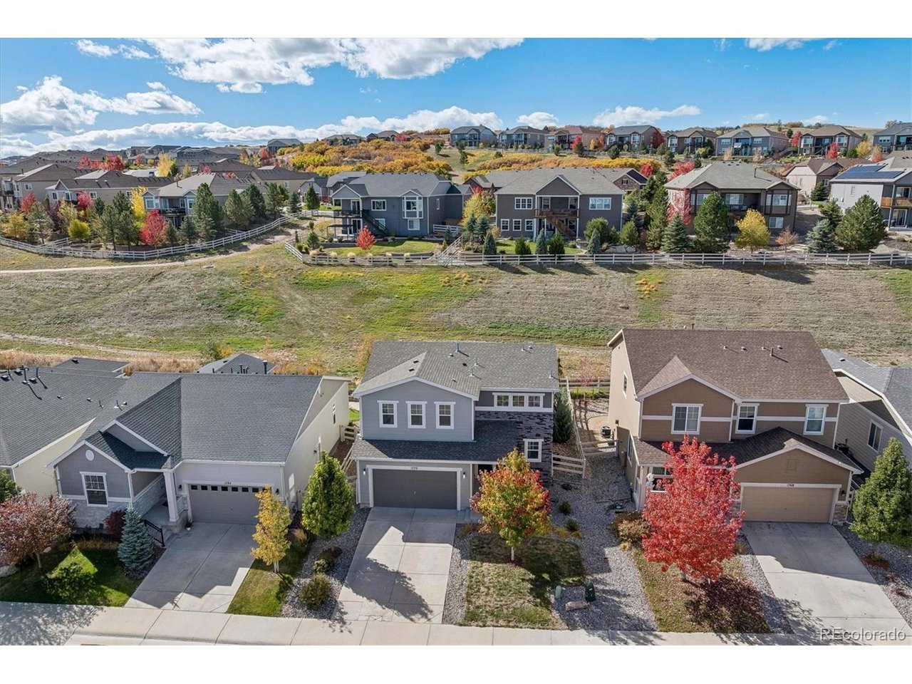 Imagine coming home to a place where open space is your backyard neighbor & Colorado's beautiful outdoors is part of your everyday life! This charming 4-bedroom, 3-bath home offers a wonderful combination of comfort, style & a fantastic lot backing to open space. Step inside to discover a bright, open floor plan designed for the way we live today. Luxury vinyl flooring extends throughout the main level, creating a beautiful, cohesive look. The kitchen is the heart of the home with quartz countertops, a gas range, refrigerator, pantry & plenty of space to prepare your favorite meals. The adjoining dining area opens through atrium doors to an incredible covered patio, extending your living space outdoors. And what a great place to spend time! Whether you're enjoying morning coffee, grilling with friends or relaxing after a busy day, this spacious patio offers ceiling fans, lighting & beautiful views of the open space beyond. The thoughtfully landscaped yard was designed with water conservation & easy maintenance in mind, giving you more time to enjoy the things you love. Upstairs, the primary suite offers a comfortable retreat with a walk-in closet & private 3/4 bath. Three additional spacious bedrooms, each with lighted ceiling fans, provide flexibility for guests, a home office or whatever fits your lifestyle. An upstairs laundry room adds everyday convenience. Additional highlights include central air conditioning & a 2-car garage. Beyond your backyard, enjoy neighborhood trails, parks & a community swimming pool. With easy access to I-25 & just minutes from the restaurants, shops & activities of Downtown Castle Rock, you'll love having so much nearby while enjoying the peaceful open space setting at home. It's a wonderful opportunity to enjoy Colorado living, both inside & out!