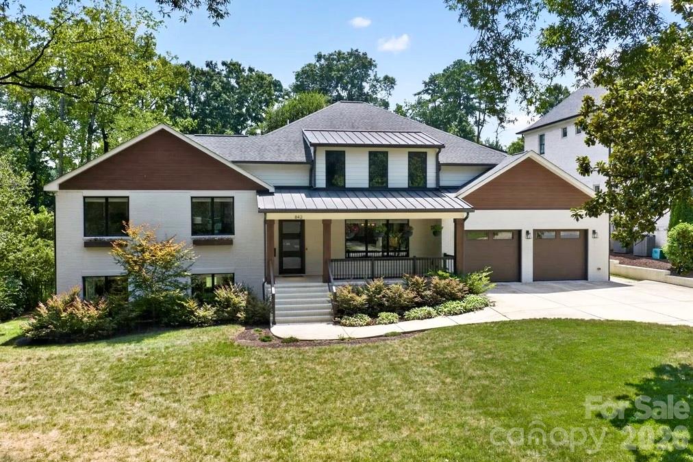 Absolutely stunning 4 bedroom 5 1/2 bath estate with over 5,200 sq ft on one of the best lots on one of the best streets in Cotswold! This stunner is a top to bottom rebuild from the ground up in 2019 by Artistic Contractors with a convenient modern design. Walnut engineered hardwoods are throughout the house & each bedroom features a full private bath & walk-in closet. The kitchen of your dreams: this true gourmet chef’s kitchen boasts an oversized island with a leather finished Galapagos quartzite countertop as its centerpiece. It also features the GE Cafe appliance package with gas range/oven & refrigerator, white tile backsplash, range/hood, custom cabinetry (plenty of storage under the island or above the cabinets), drop zone/laundry room & walk-in pantry. Butler’s pantry leads to the dining room & adds just the right touch for entertaining or dining. An owner’s  retreat the way you always wanted to design it: oversized primary bedroom with trey ceiling (plenty of room for a California king). It also features a luxurious en suite bath with white Carrera marble on floor, shower & wall surround, Essence Harmony & Essence Legacy marble & art glass in emerald, soaking tub, dual vanity, walk-in shower with rainfall shower head & a spacious walk-in closet with folding/organizing station & private laundry room (it even has extra storage space on both sides of the closet). The faucets, diverter, handheld & body sprayers are part of the Brizzo Jason Wu Collection. Lavish private heated Pebbletech saltwater pool with lights & tanning ledge overlook 0.77 acres of wooded serenity. A whole separate yard at the back of the property also provides a wealth of possibilities. The heart of the home is the living room & it features coffered ceilings, built-ins and opens onto the sunroom & spacious kitchen. Bright open sunroom with collapsing glass doors that open onto the sun-drenched pool & terrace, cathedral ceiling with two skylights, gas fireplace with handmade Moroccan Zelige tile & Mansion porcelain tile floor. Lower level features a family room/media room/playroom with its own kitchenette with sink, dishwasher & refrigerator &  full bathroom. Possible office space there as well. Ideally situated in the classic & highly sought after neighborhood of Cotswold. Convenient to just about everything: shopping, dining, schools, entertainment, parks, SouthPark & minutes from uptown. Tasteful… modern… expansive… relaxing… luxurious. This home has it all! Additional information on the builder & this fabulous house is available on their website at: https://artisticcontractorsnc.com/portfolio/linda-lane/