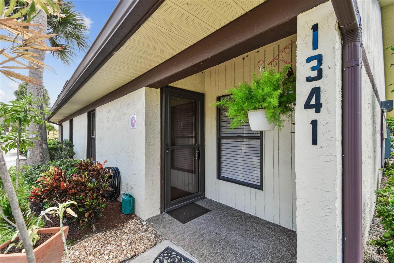 In the desirable San Christopher condominium complex, this fully upgraded corner unit offers a blend of modern style and exceptional convenience, just minutes from downtown Dunedin. The interior showcases new quartz countertops, new shaker-style cabinetry, new high-end vinyl flooring, and stainless steel appliances, including a new dishwasher and new disposal. Upgraded lighting and ceiling fans throughout elevate functionality and comfort. A screened-in patio overlooks a tranquil preserve, offering a peaceful outdoor retreat. Roll-down hurricane shutters for added protection and security. Covered parking adds to the convenience of this low-maintenance lifestyle. Community amenities include a clubhouse and sparkling pool, with proximity to Pinellas Trail, gulf beaches, shopping, dining and more. Experience the best of coastal living with modern finishes and an ideal location. Schedule your private tour today.