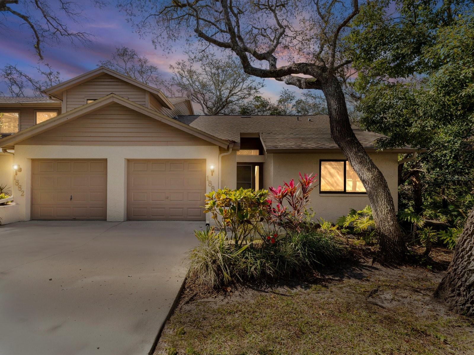 Peaceful End-Unit Villa Backing to Lush Conservation Preserve! Welcome to 1880 Whispering Way in Whispering Woods, a private end-unit villa in Tarpon Springs backing to West Klosterman Preserve. Tucked inside one of Tarpon Springs’ hidden gem communities, this 2-bedroom, 2-bath villa offers low-maintenance Florida living with privacy, natural light, and a split-bedroom floor plan ideal for snowbirds, downsizers or full-time residents.Inside, vaulted ceilings and an open layout create a spacious feel, while sliding glass doors lead to a screened patio overlooking protected green space. The updated kitchen features abundant natural light and flows seamlessly into the main living area, making the home feel bright and welcoming. Fresh interior paint and newer carpet add to the move-in-ready appeal.The primary suite is privately positioned, while the guest bedroom and full bath sit on the opposite side of the home for added flexibility. The roof was replaced in 2023, offering peace of mind for years to come.Whispering Woods is a quaint Tarpon Springs community with a pool overlooking the lake and tennis courts, located just minutes from Fred Howard Park, Sunset Beach, historic downtown Tarpon Springs, the Sponge Docks, shopping, dining, and Gulf beaches.If you’re searching for a conservation view villa in Tarpon Springs with privacy, natural surroundings, and easy access to everything the area offers, this home delivers.