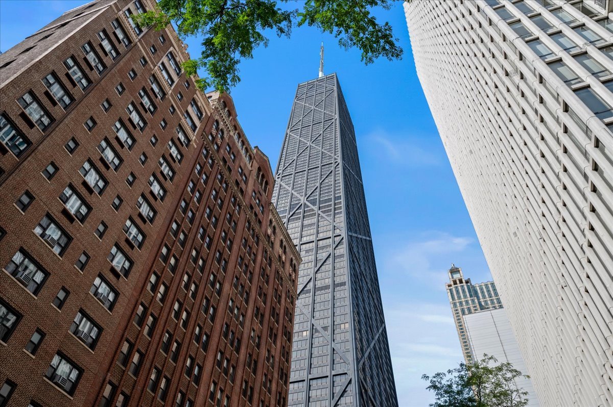 Experience luxury living high above Chicago in the iconic John Hancock Center. This rare, all-original 2-bedroom, 2-bath residence on the 79th floor features a private sky terrace, an offering almost never available at this height. With totally unobstructed south-facing views, this home showcases breathtaking panoramas of the city skyline, Lake Michigan, and sunsets that transform the horizon into your backdrop. The spacious open floor plan combines living and dining areas with walls of windows that flood the home with natural light. The primary suite includes an en suite bath, while a second full bath offers convenience for guests. The crown jewel, the private sky terrace, delivers an unparalleled indoor-outdoor lifestyle in one of Chicago's most prestigious buildings. Residents of the John Hancock Center enjoy world-class amenities including:  * 24-hour door staff and resident chief engineer  * State-of-the-art fitness center and full-length indoor pool  * Party rooms for entertaining  * On-site conveniences such as a grocery store, dry cleaner, 1-   gigabit internet, Starbucks, The Cheesecake Factory, Benihana, Chase Bank, and a U.S. Post Office.     Perfectly positioned on the Magnificent Mile, you'll enjoy immediate access to Chicago's premier shopping, dining, cultural attractions, and lakefront recreation. Don't miss this one-of-a-kind opportunity to own a condo in the 79th floor in the sky terrace in one of Chicago's most recognizable landmarks.