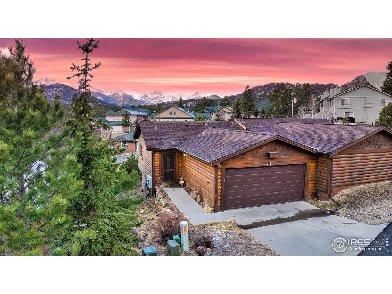 Incredible location above Downtown Estes Park with unobstructed views of Longs Peak and the Continental Divide! You'll find yourself in the heart of Downtown exploring shops and eateries within a 5-minute walk! This turn-key, fully furnished and immaculate, 3-bed 2-1/2 bath townhome offers breathtaking views from an expansive deck accessible from both the upstairs living room and the primary suite. Imagine setting a beautiful dinner table where the main course is served with a side of panoramic mountain views! The lower level boasts two additional bedrooms, a bonus/media room and a full bathroom while also having access to the great outdoors! Set up your personal tour today as you don't want to miss out on this Mountain Masterpiece!