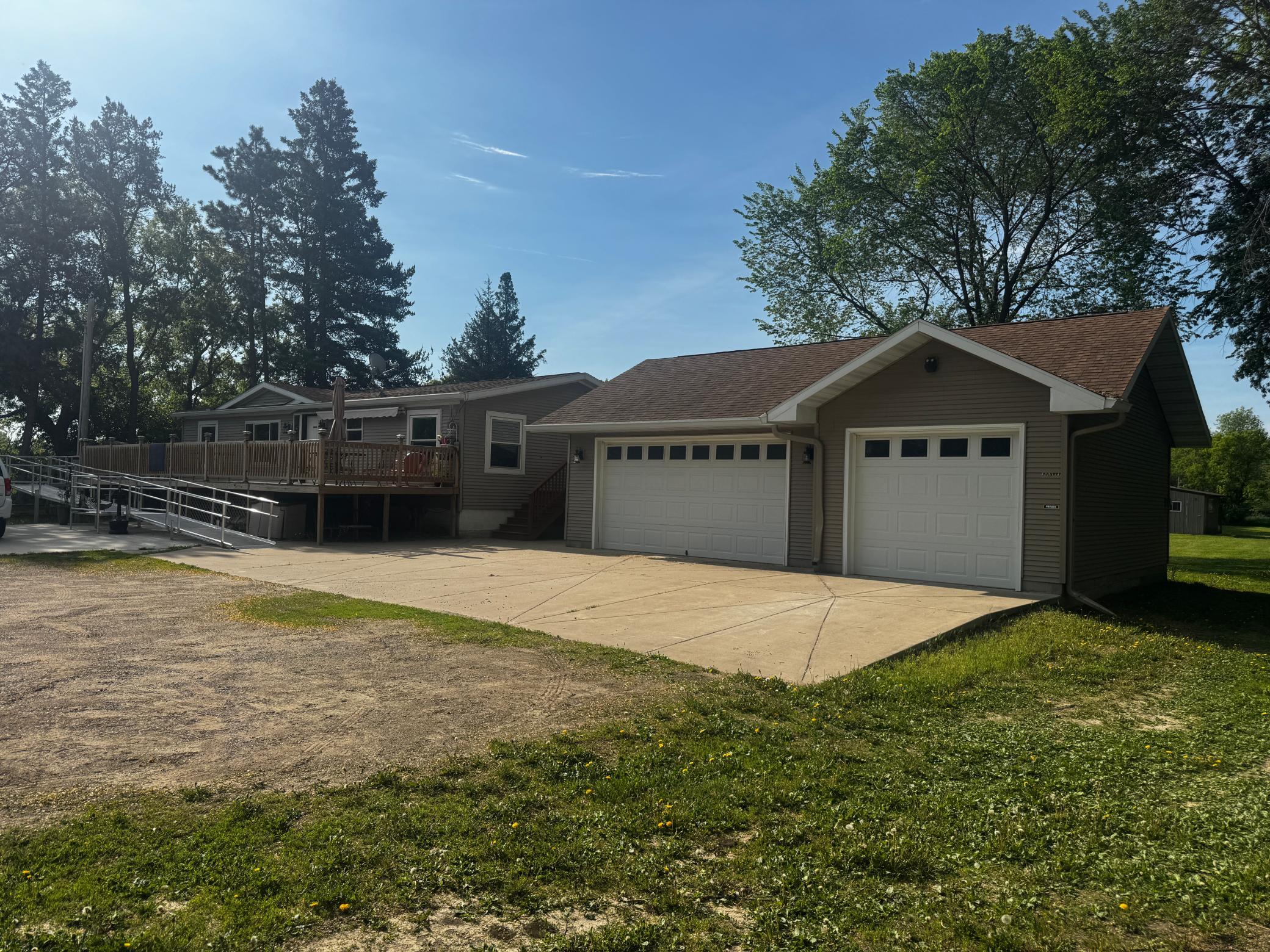 Rare opportunity in a fabulous private location!  Over 2 acres on the edge of town.  This property was a licensed residential foster home.  Opportunities are endless, bring your dream or enjoy this property as a single family home.5+ bedrooms 2+ bathrooms, 2 laundry areas with washers and dryers, lower level kitchenette with chair lift. 3+ heated garage and additional garages and storage. This is a manufactured home on a block foundation, the title has been surrendered to the state and structural engineer report is available in the supplements. Sale Includes Parcel #'s 481850000,481859000,486414000,481857000