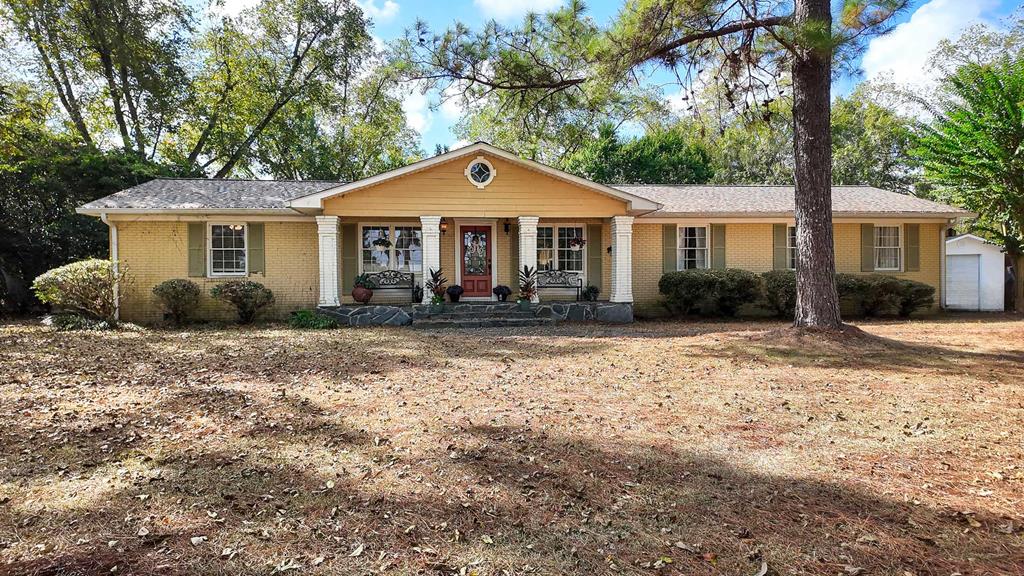 Nestled just outside of Barwick in Thomas County, this stunning 3,368 sq. ft. brick home is a perfect blend of elegance, comfort, and functionality, all on 1.11 acres. From the moment you step inside, you'll be drawn to the inviting natural light pouring through the expansive windows, creating a bright and welcoming atmosphere throughout. The kitchen is truly the heart of this home—designed to impress both the home chef and the entertainer. Granite countertops, a gas stove, double ovens, custom cabinetry, and detailed coffered ceilings combine to create a space that is both beautiful and highly functional. The living areas feature parquet flooring and elegant tile, providing warmth and style in every corner. Each of the three bedrooms offers incredible space, with room for oversized furnishings and more. The bathrooms are equally luxurious, showcasing walk-in showers and soaking tubs, giving you the perfect retreat at the end of the day. But the features don't stop there. Step outside to discover a 500 sq. ft. detached bonus space, complete with a full bathroom. Whether you dream of a private man cave, a game room, guest quarters, or a creative studio, this versatile space is ready to deliver. For those who need storage or a place to tinker, the detached garage and workshop provide endless possibilities. This property offers the best of both worlds—peaceful country living with plenty of space to spread out, yet just a short drive from Thomasville, Barwick, Boston, and all the conveniences you need. Every detail of this home has been crafted for both daily living and unforgettable gatherings, making it the kind of place you'll never want to leave.