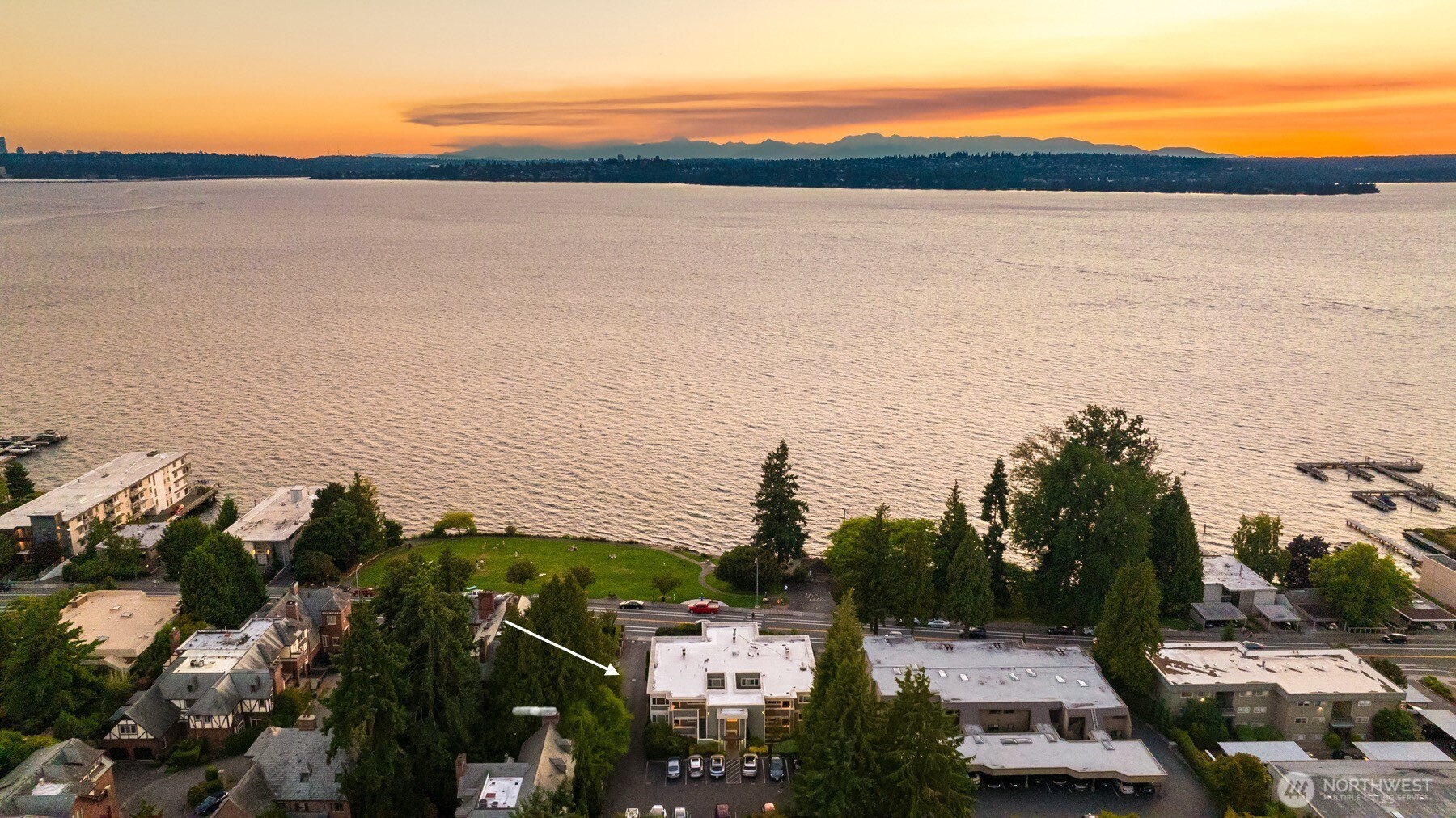 Priced to sell, just steps from the shore in this 2 bed, 2 bath gem at The Park. Soak in unobstructed views of the lake, city skyline & Olympic Mtns. The chef’s kitchen opens to a sunlit dining/living space w/fireplace framed by stunning floor-to-ceiling windows. Step onto the patio & open lawn to watch eagles soar—offering rare privacy & panoramic beauty all year. The serene primary suite is a retreat w/breathtaking views. Stroll to town, parks, top eateries & cafés on those dreamy Kirkland nights! No rental cap, walk out patio, storage space, & easy parking. New interior paint, carpet, lightning+more.  Other units in the building have sold for higher prices, leaving untapped equity potential for this one.