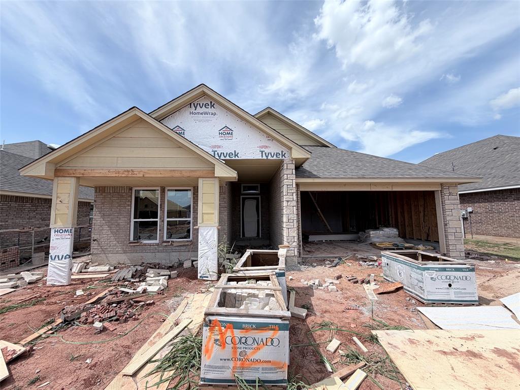 This is the beautiful Taylor Elite plan. Featuring a warm and open layout, you will love the flow of this home. You enter into a wide area that draws you into the living room with it's statement built-in fireplace and mantle. The kitchen is loaded with custom cabinets, a big island, thick quartz tops, deep undercounter sink, under cabinet lighting, decorative wood vent hood, Samsung stainless steel built-in appliances and more. Wood tile in all of the main areas and hallways. The primary bedroom is spacious and the primary bathroom has a wide two sink vanity, soaker tub, floor to ceiling tiled shower and huge closet with seasonal storage. One of the spare bedrooms is oversized giving lots of options. Very energy efficient home. Neighborhood amenities include a playground, pool, clubhouse with fitness center and gathering hall!