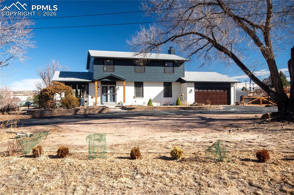 Great home in a quiet rural setting, right in town and zoned equestrian!  Full renovation in recent years including quality Anderson windows, scraped hardwood flooring, solid doors, finished Lower Level. Completely redone Kitchen with granite island and eating bar, stainless appliances, gas range and hood, tile backsplash, pantry and bay window. Family Room with woodburning Fireplace (not being used), brick hearth, built-in shelves. Formal Dining Area, Kids Playroom with walkout to Patio. Half Bath and large Laundry/Storage Room with cabinets and sink off Garage on the Main Level. Four Bedrooms and a spacious Bathroom upstairs, Primary Bedroom has it's own ensuite 3/4 Bath. Lower Level has a huge 29'x13' Rec Room, 5th Bedroom, beautiful 5-pc tile Bath, plus Workout and Bonus Rooms. Newer hardboard siding, water heater, upgraded electrical panel, 8 y/o roof.  Home has central AC, security system. Huge, fenced yard with views has a 20'x20' patio plus wood sitting area, firepit, kids play system, storage shed and chicken run, planter beds. Corner lot with circular driveway. Excellent D20 Schools. Super convenient access to I-25, North Academy shopping, dining, and entertainment.  Don't miss this home!