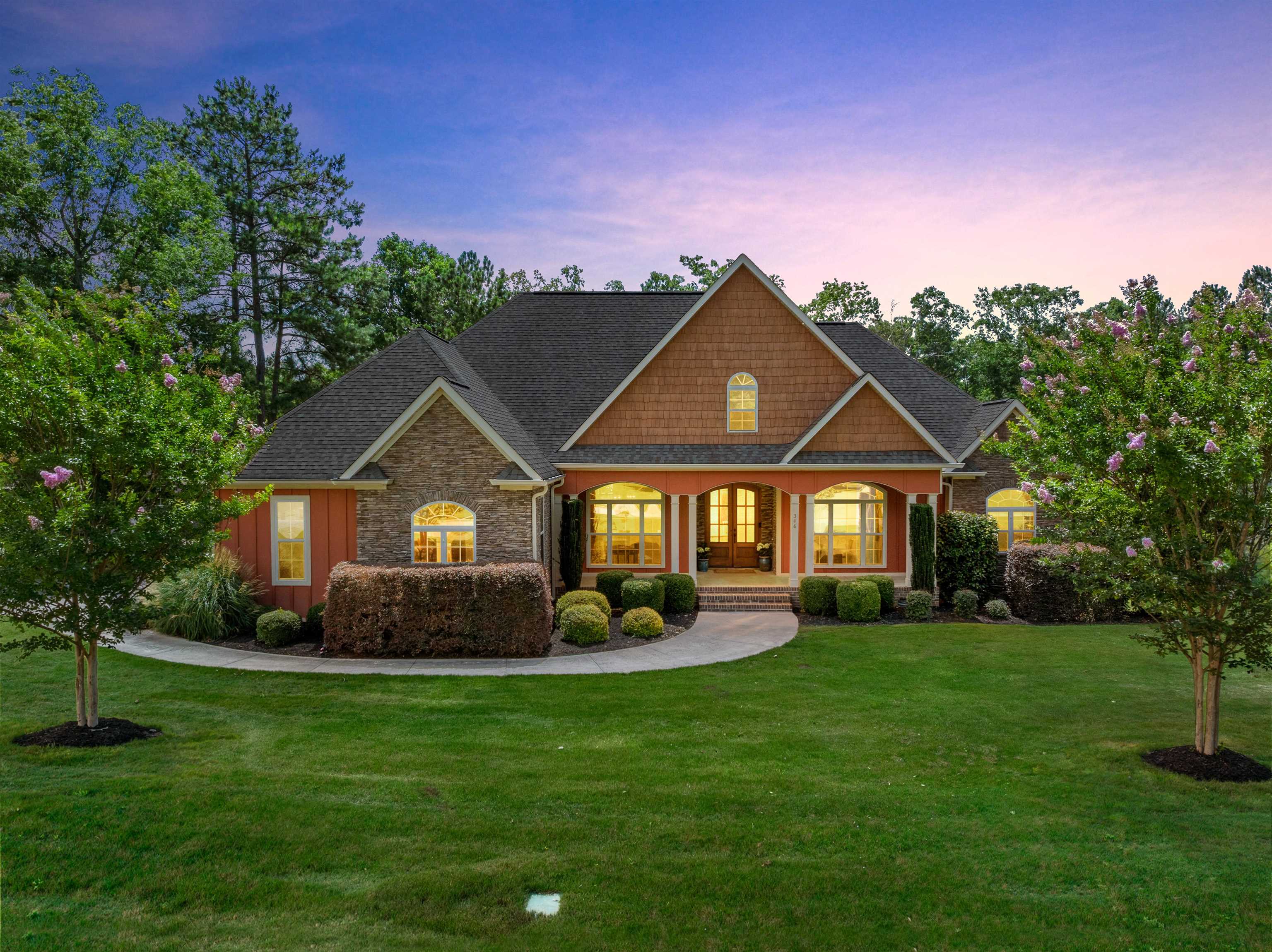 Welcome to this exceptional custom home in desirable Cane Creek, where mature landscaping, timeless architecture, and thoughtful design create a truly remarkable living experience. A spacious front porch welcomes family and friends, offering the perfect setting for gathering and enjoying the beauty of the neighborhood. As the arched double gorgeous front doors open, you'll immediately appreciate the intricate details and craftsmanship found throughout the home. The foyer features a built-in shelf, beautiful hardwood flooring throughout, and elegant finishes that set the tone for the rest of the residence. Just off the entry, a versatile bedroom or office showcases a double tray ceiling, extensive molding, and a stunning arched window that fills the space with natural light. The formal dining room is equally impressive, featuring multiple tray ceilings, a beautiful chandelier, recessed lighting, and a striking arched window that creates an elegant setting for entertaining. The living room offers a soaring vaulted ceiling, expansive windows, and custom built-in bookcases flanking the gas log fireplace, creating a warm and inviting focal point. The heart of the home is the beautifully designed kitchen, complete with custom wood cabinetry, a decorative range hood, built-in wall oven and microwave, granite countertops, and a large island featuring contrasting neutral-toned cabinetry with seating for multiple bar stools. The breakfast nook overlooks the backyard and flows seamlessly into the family room, making everyday living and entertaining effortless. The family room is designed to impress with its vaulted ceiling, expansive windows, and four custom built-in bookcases with lower cabinetry, providing both character and functionality while flooding the space with natural light. The primary suite serves as a private retreat, featuring a double tray ceiling, sitting area, and French doors leading directly to the screened porch. A stylish barn door opens to the luxurious ensuite bath, where you'll find dual vanities, extensive cabinetry, a soaking tub positioned beneath a beautiful arched window, and a spacious tiled shower complete with a bench seat and storage niche. Two spacious secondary bedrooms have beautiful wood floors are connected by a convenient Jack-and-Jill bath featuring a double vanity and ceramic flooring. The thoughtfully designed laundry room offers granite countertops, ceramic tile flooring, wall and floor cabinetry, and a hanging bar for added convenience. Outdoor living is equally impressive. The screened porch showcases beautiful wood beams and an arched wood beam ceiling, creating a breathtaking space to relax while overlooking the private, fully fenced backyard. Beyond the porch, a spacious deck with wrought-iron railing provides additional room for entertaining. The backyard resembles a private park, reflecting exceptional care and maintenance, and includes a dedicated area for a playset. Residents of Cane Creek enjoy outstanding community amenities, including walking trails, a playground, a covered recreation area with a fireplace, a scenic pond with a dock, and inviting green spaces throughout the neighborhood. Combined with its convenient location and exceptional craftsmanship, this is a home that must be experienced in person to fully appreciate all it has to offer.  NEW HVAC, 5 ton installed 8/1/2026