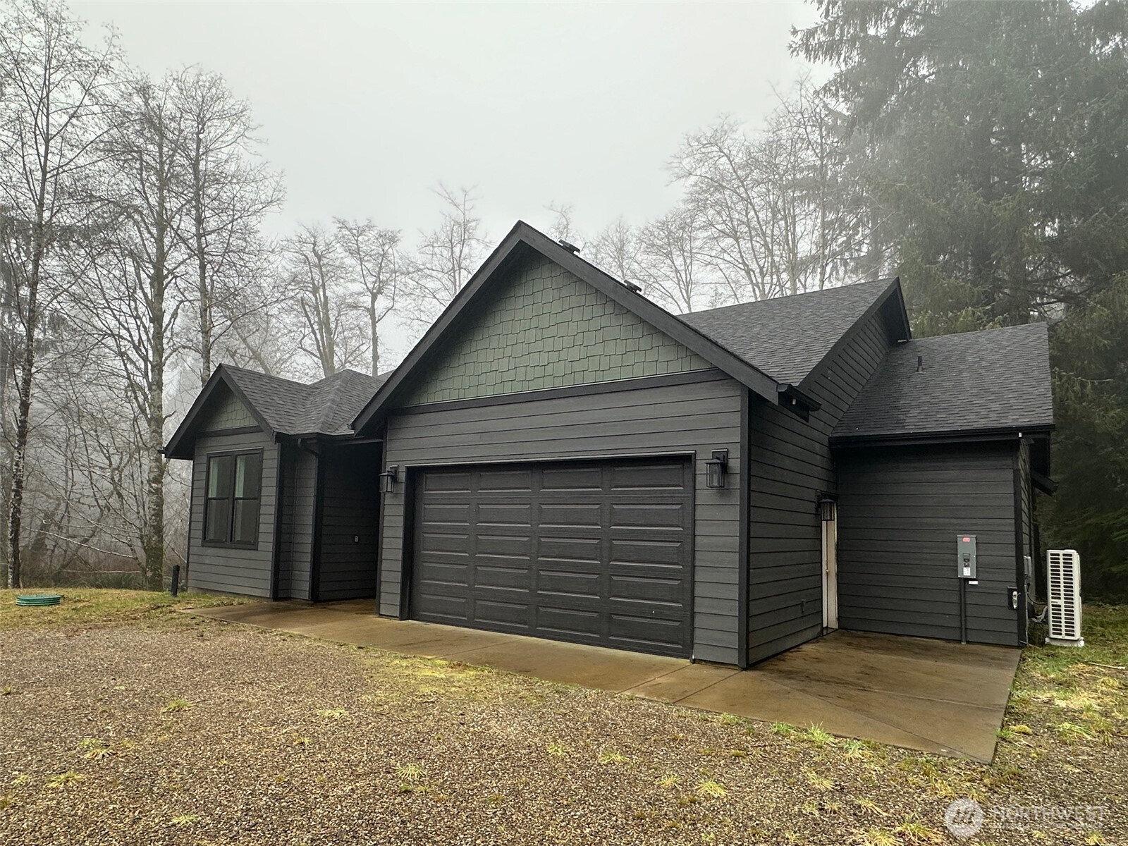 Almost-new 3-bedroom, 2 bath home on 5 private acres along the river! This exceptional riverfront property offers the perfect blend of comfort, space & lifestyle. Inside, soaring vaulted ceilings & luxury vinyl plank flooring flow throughout, creating a bright, open feel. The kitchen shines with quartz countertops, stainless steel appliances & a seamless connection to the great room. A cozy wood stove efficiently heats the home, adding warmth & charm. Step outside to the expansive covered deck overlooking the river the ideal spot for morning coffee or evening unwinding. And for the hobbyist or mechanic? A massive 30x60 shop/garage completes the package. Move-in ready & waiting for you.