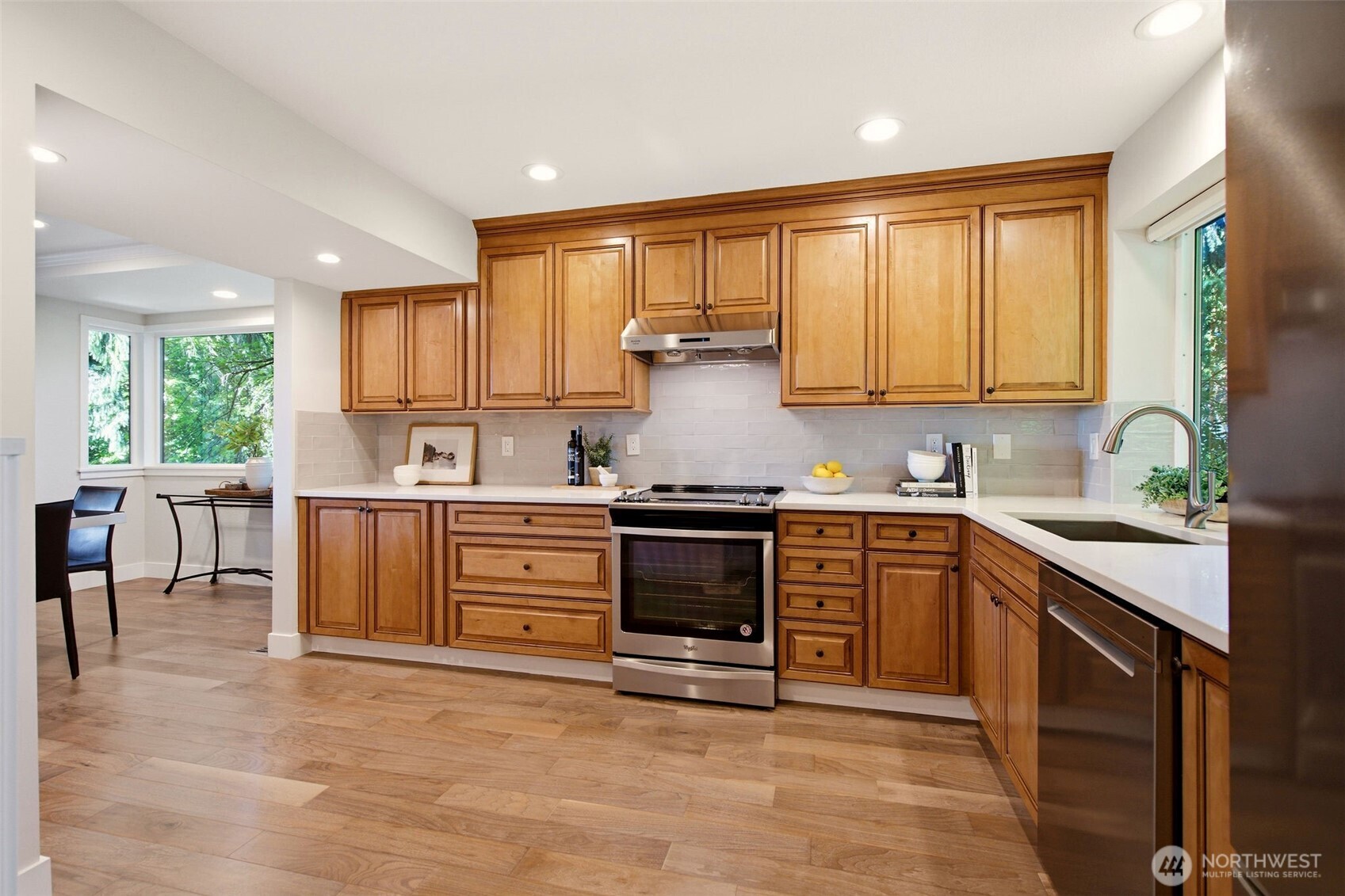 Well-appointed kitchen featuring abundant cabinetry and generous prep space.