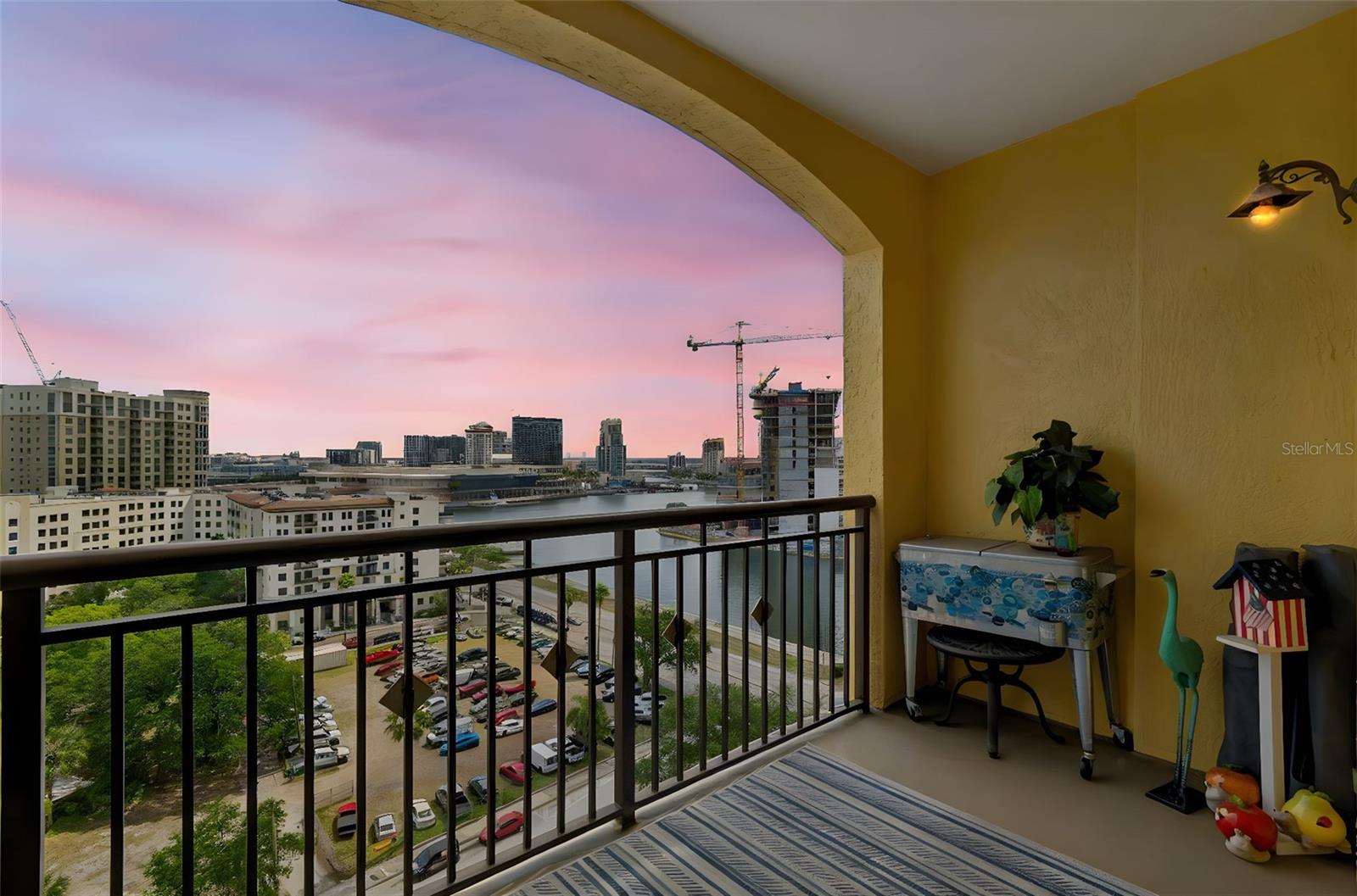 Luxury condominium on Bayshore Boulevard with bay and city views in South Tampa. At 345 Bayshore, this two-bedroom, two-bath residence offers direct views of Hillsborough Bay from all primary living areas, along with views of the Tampa skyline, creating a dual-view living environment. Designed for primary and seasonal ownership, the interior features granite countertops and backsplash in the kitchen, with matching granite surfaces throughout both baths. The layout emphasizes natural light and water-facing sightlines. The building provides a porte-cochere entrance and 24-hour front desk services. Amenities include a health and fitness center with cardio and weight-training equipment, aerobics space and sauna, as well as a heated pool and outdoor whirlpool spa. Additional features include a clubroom, private conference room, wine storage, library, business center with wireless connectivity, storage lockers and on-site property management. Along Bayshore Boulevard with access to the Bayshore Boulevard Greenway, the residence is within proximity to downtown Tampa. Nearby destinations include Amalie Arena, Tampa Convention Center, Florida Aquarium, Sparkman Wharf, the cruise port and Curtis Hixon Waterfront Park. This South Tampa condominium offers a waterfront location, skyline views and access to urban amenities within a managed residential setting.