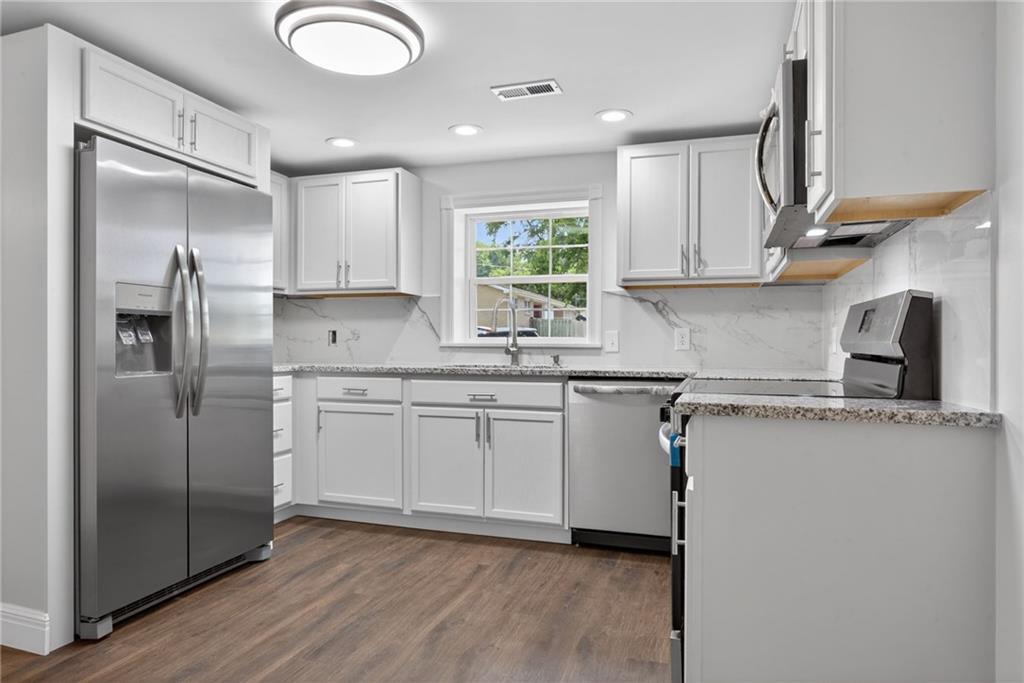 Completely transformed with exceptional attention to detail, this beautifully renovated 3-bedroom, 2-bathroom home offers the perfect blend of modern design, quality craftsmanship, and everyday comfort. Every space has been thoughtfully updated to create a home that feels fresh, stylish, and truly move-in ready.Step inside to discover new flooring, a stunning designer-inspired kitchen, beautifully remodeled bathrooms, and carefully selected finishes that bring warmth and sophistication throughout. The kitchen is equipped with all-new appliances that stay with the property, making this home truly turnkey from day one. The open, inviting layout is perfect for entertaining and everyday living, seamlessly combining functionality and style.Enjoy peace of mind with a new roof, HVAC system, and furnace, providing comfort, reliability, and confidence in some of the home's most important systems. With the look and feel of new construction, this home delivers the benefits of a complete renovation while maintaining its unique character.Whether you're searching for your first home, ready to upgrade, or simply want a turnkey property without the stress of major updates or immediate expenses, this home is ready to impress from the moment you walk through the door.