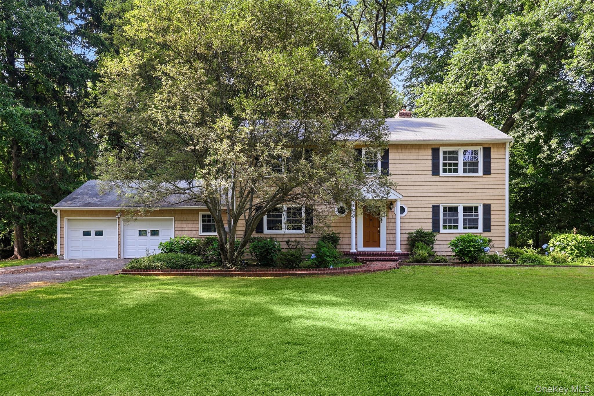 Wonderful Colonial in the coveted Hartsdale Estates neighborhood, privately set at the end of a quiet drive on a flat, private property. A rare handyman special offering endless potential to bring your imagination and create the home of your dreams. This classic Colonial is ready for its next chapter and has all the makings of a magnificent estate. The home features a formal living room with fireplace, formal dining room, eat-in kitchen, family room with fireplace, mudroom, and screened porch. Upstairs offers three bedrooms, a hall bath, and a spacious primary suite with a private bath. An ideal floor plan for today's buyer, all in a premier location. Priced to sell, this is an exceptional opportunity to customize a home in one of Hartsdale's most sought-after neighborhoods.