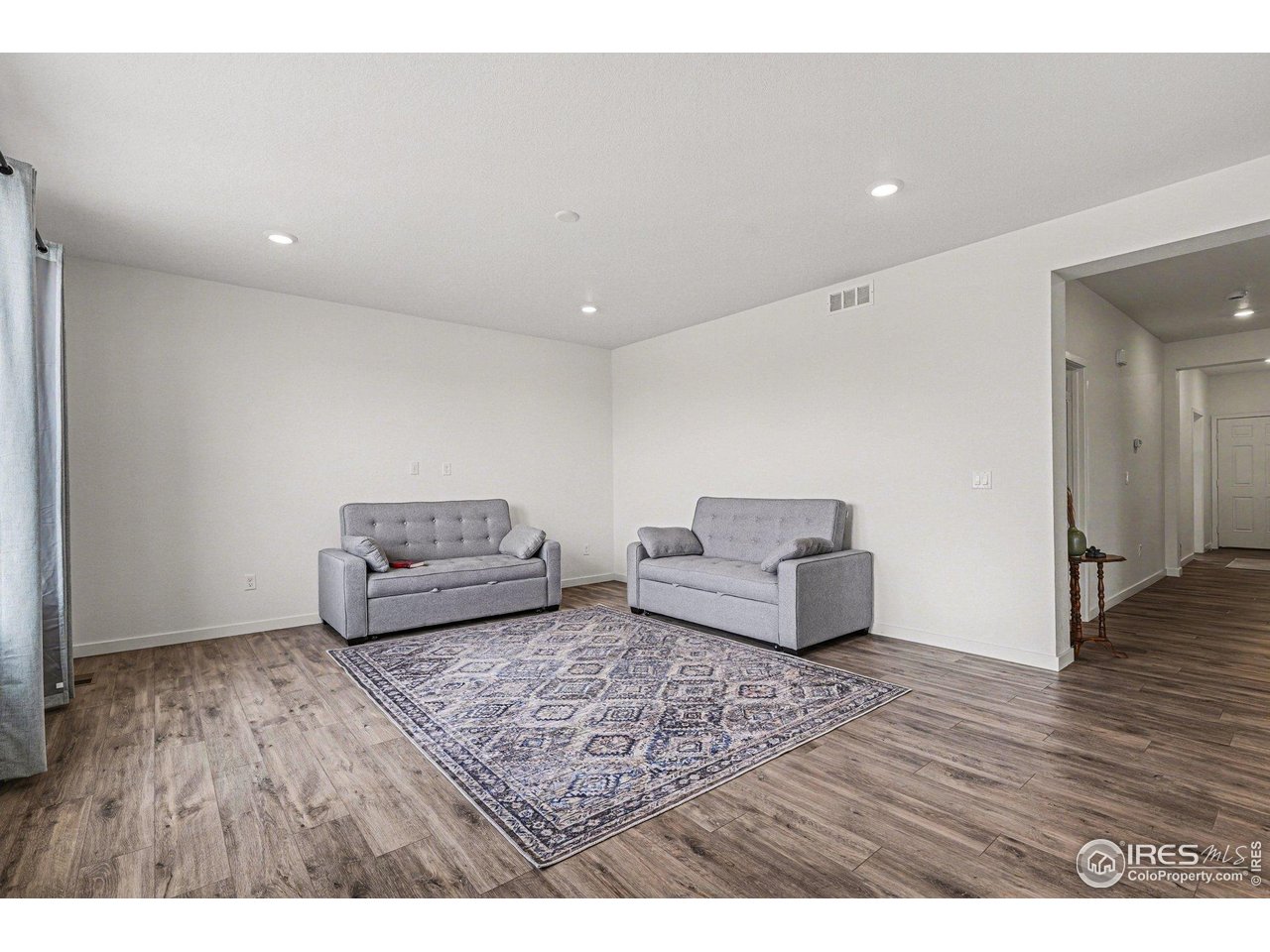 Welcome to this spacious and thoughtfully designed two-story home tucked away in a quiet Cul-de-sac, offering 5 bedrooms, 4.5 bathrooms, and a 4-car tandem garage. The main level features a bright and open floor plan where the kitchen, dining area, and living room seamlessly flow together - creating the ideal space for gatherings and everyday living. The kitchen opens directly to the main living area, keeping everyone connected. A convenient half bath on the main level serves as a guest bathroom for added comfort and accessibility.A standout feature of this home is the private main-level suite with its own separate entrance. This incredible space includes a bedroom, bathroom, living area, small kitchenette, and its own dedicated laundry closet - perfect for multi-generational living, long-term guests, rental potential or even a home business setup. Upstairs, you'll find the other bedrooms along with a spacious open loft that can serve as a second living area, office, or sitting room. The primary suite is generously sized and features a large ensuite bath and two separate walk-in closets. Two of the secondary bedrooms are connected by a convenient Jack-and-Jill bathroom, while the additional bathroom provides comfort and privacy for everyone.The unfinished basement offers endless possibilities to expand and customize to fit your needs. Outside you can continue your creativity in the untouched backyard, offering the freedom to create a beautiful outdoor living space - whether that be a patio, garden, or outdoor entertainment space.Don't wait and schedule your showing today!