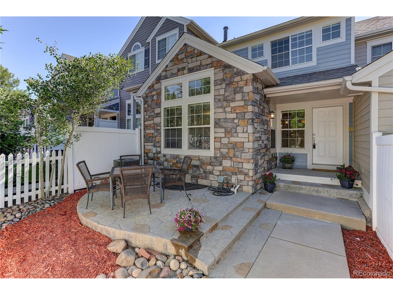 SELLER SAYS SELL IT AND GET IT DONE! $47,500 IN PRICE PRICE REDUCTIONS ON THIS BEAUTIFUL AND METICILUOY RENOVATED TOWNHOME. Seller also offering to pay buyer closing costs and buy downs with negotiated offer. Featuring 4 bedrooms and 4 baths, 2 car attached fully finished garage with a new door in a safe/quiet sought after Broadlands neighborhood.  Totally low maintenance living.  Seller has detailed the unit and has INVESTED $30,000 all in the last few months.  Featuring BRAND NEW interior paint throughout including the garage.  Brand new carpeting throughout. Brand new vinyl luxury plank flooring on the entire main level. Brand new furnace.  Featuring an open floor plan with vaulted ceilings, a cozy professionally serviced living room gas fireplace and a separate dining area with an updated half bath.  Beautifully detailed kitchen with 42 inch cabinets, tile backsplash, double sink, slab granite counter tops and even a rough in for natural gas. All appliances stay and did I mention a brand new dryer. Master bedroom has its own level with a 5 piece bath, 12 inch tile flooring and a new shower lining. Living room and master bedroom are pre wired for sound.  Two additional upper level bedrooms with new carpet and paint adjacent to a full bath.  All 4 bedrooms have their own ceiling fans.  Adorable white picket fenced frontal patio area for morning coffee and full relaxation.  Basement is 90% finished and with an additional bedroom and beautifully updated 3/4 bath, separate laundry room, folding table and additional cabinets. Separate utility room for additional storage.  Radon mitigation system and sump pump already installed. Shows like brand new! Walk to nearby shopping, Broadlands golf course, bike paths, banking and other conveniences.  Total turn key and eye opener!