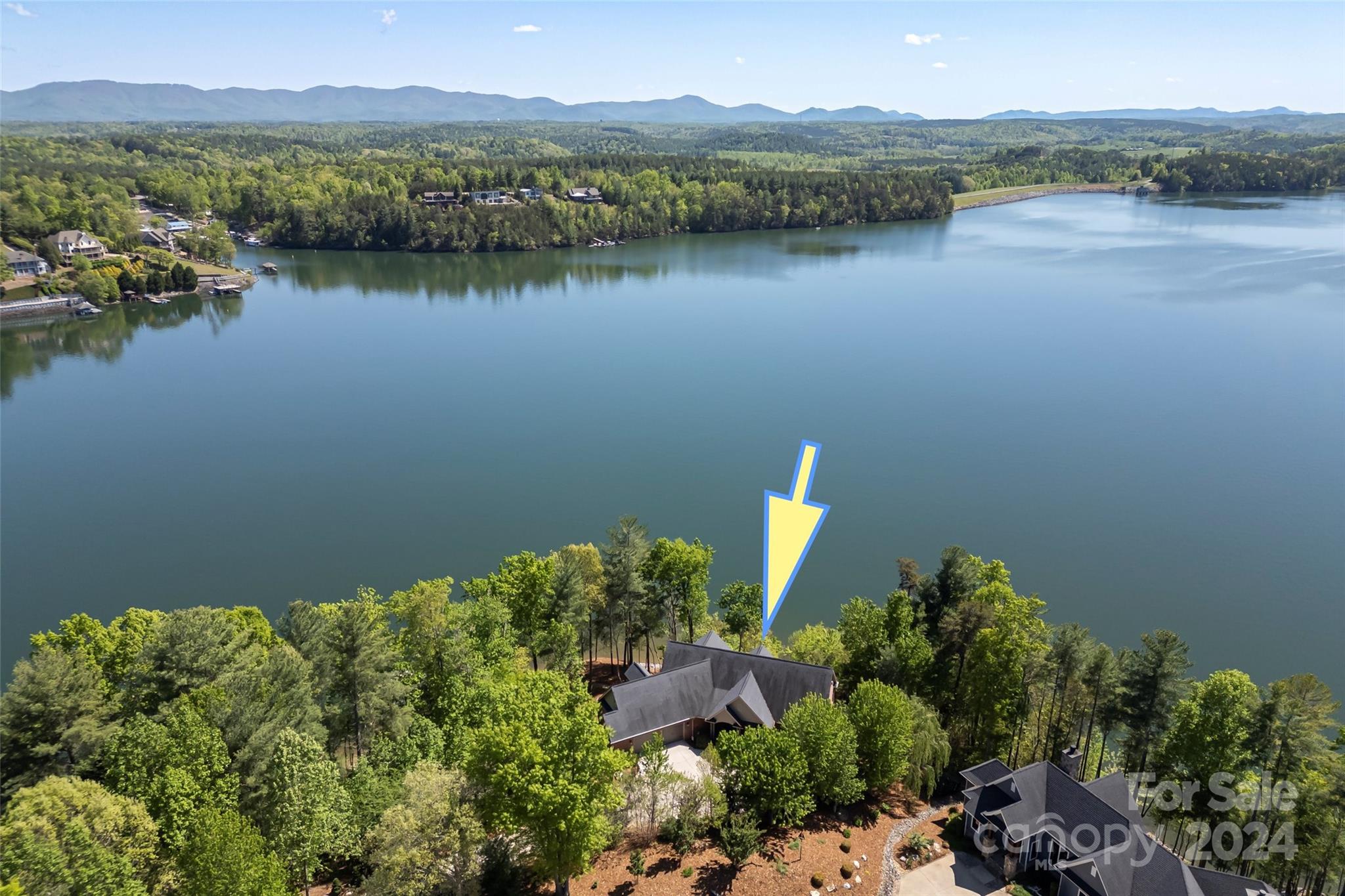 Spectacular South Mountain & lake views from this 1.3 acre point lot on Lake James. Enjoy the views from the living room by the cozy fireplace or while eating meals in the combined kitchen and dining area.  Primary bedroom has equally fabulous views & ensuite bath w/large tiled shower, double sinks and 2 walk in closets.  Additional bedroom/office on main level. Finished bonus room over garage makes a great office. Guests & family will enjoy the finished lower level with 2 bedrooms, 2 full baths & family room for gathering.  Loads of unfinished space for storage and all your lake toys.  Large covered front porch, rear covered porch and open deck spanning the entire rear of the house. 2 car garage.  Take the gentle walkway to firepit and stone patio and continue to dock with lift and jetski ports. Southpointe has community pool & walking trails.  Morganton is just 20 minutes away for shops and restaurants.  See the view: Sky tour https://tours.3amvirtualmedia.com/tours/cATZODvl3?mls=1