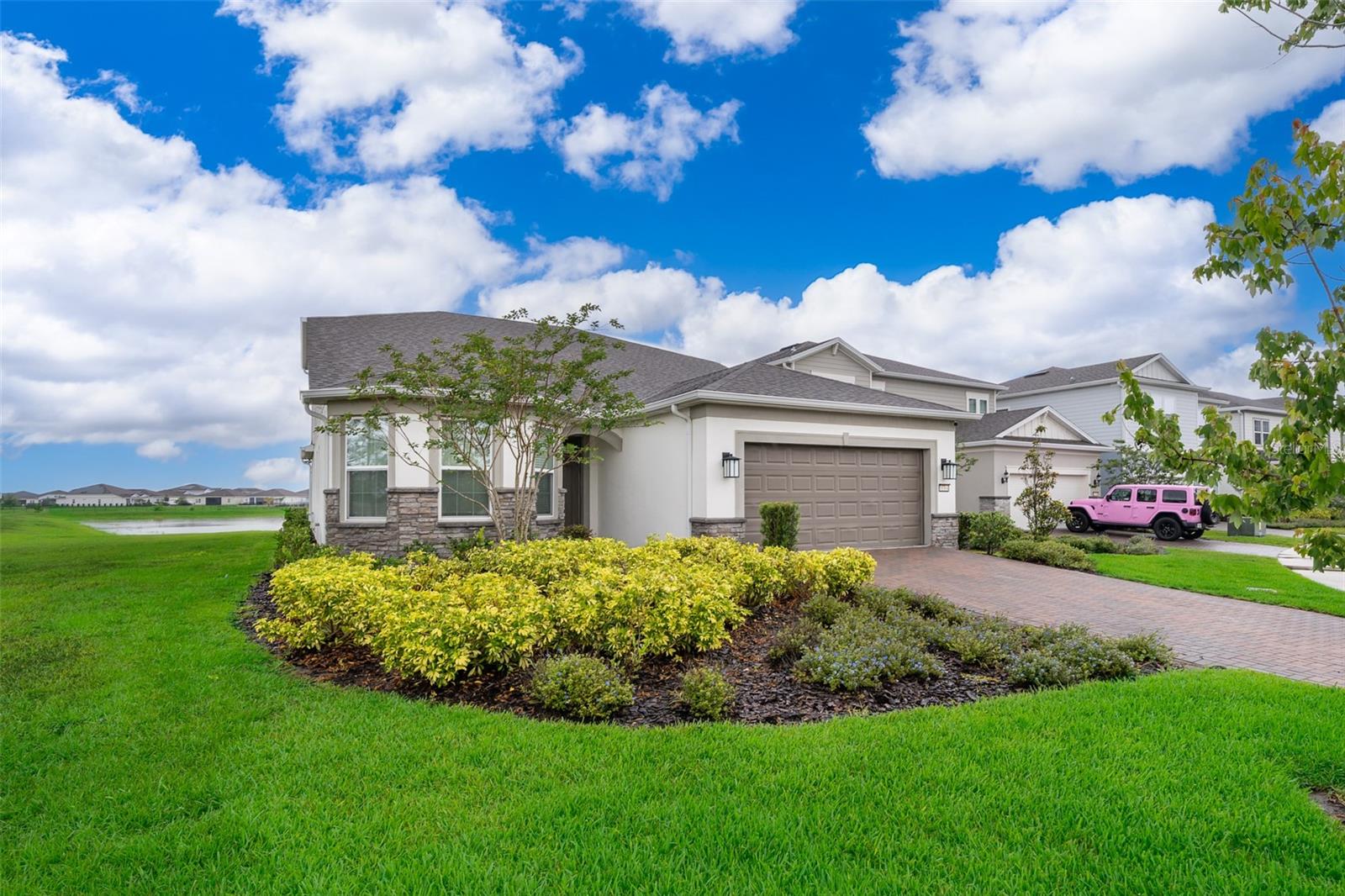 Welcome to this beautifully upgraded and spacious home located in the highly sought-after gated community of Isles of Lake Nona! This stunning property sits on a premium corner lot with serene water views and boasts over 3,100 square feet of living space, featuring 4 bedrooms, 4 bathrooms, a private office, and a large bonus/game room.



Gourmet Kitchen: Perfect for entertaining, the open-concept kitchen features quartz countertops, stainless steel appliances, a natural gas cooktop, walk-in pantry, and a grand center island that flows seamlessly into the spacious family room and dining area.
Luxurious Owner’s Suite: The first-floor owner’s suite offers a private retreat with a spa-like bathroom, dual vanities, and ample closet space.
Elegant Upgrades Throughout: Enjoy wood-look tile flooring on the main floor, real wood flooring upstairs, and a beautifully designed outdoor kitchen for year-round enjoyment.
Outdoor Oasis: Step through expansive sliding glass doors into your backyard haven—complete with no rear neighbors, pond views, and a fully equipped outdoor kitchen ideal for entertaining.
Flexible Living Space: Upstairs features a spacious bonus/game room, perfect for movie nights, plus an additional private bedroom and full bath—ideal for guests or multigenerational living.


Residents of Isles of Lake Nona enjoy world-class amenities including:

24-hour gated security
Resort-style pool and clubhouse
State-of-the-art fitness center
Tennis, pickleball, and basketball courts
Scenic walking trails and more!


Just minutes from Lake Nona Medical City, Orlando International Airport, USTA National Campus, top-rated schools, and major highways (SR 417 & SR 528), offering quick access to shopping, dining, and Orlando’s top attractions.