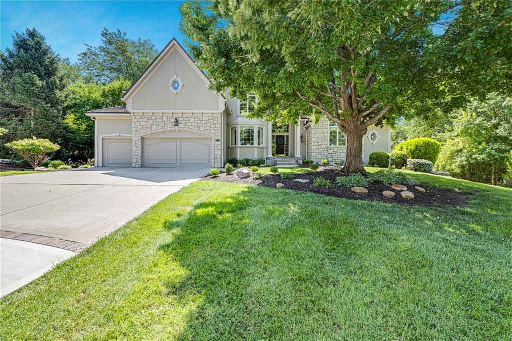 Stunning Custom Built Masterpiece on Extensively Landscaped Cul-de-Sac Lot! Lofty 2 Story Entry with Curved Staircase, All New Carpet on Main Level and Staircase. Elegant Dining Room, 1st Floor Office with Built-Ins & Large Great Room with Fireplace & Wall of Windows! Beautiful Kitchen Boasts Large Island, Walk-In Pantry & Tons of Built-ins & Storage. Cozy Hearth Room with Amazing Masonry Fireplace and Breakfast RM Area. Spacious Owners Suite with Brand New Hardwood Flooring Plus Sitting RM Area & Large Primary Bathroom/ Closet. Functional Floor Plan Filled with "Extras" like an Upstairs Loft & Large Secondary Bedrooms All with Huge Closets. Finished Walkout LL Features 3rd Fireplace, Handsome Huge Bar/ 2nd Kitchen, Rec Room Area, Media Room Area, Billiards Area, Tiled Sunroom Area in Addition to a 5th Bedroom Plus a Full Bath AND a Half Bath! Large Unfinished Storage Space Also. Lower Level is Perfect for a Separate Apartment Space for Extended Family Members, Adult Children, OR an Amazing Family and Entertaining Space! Cedar Creek is a Lifestyle Neighborhood with Amenities to Include a 65-acre Fishing, Sailing/ Canoe / Kayak Lake, Dock Access for Small Boats, 2 Swimming Pools, Two Story Clubhouse w/ Indoor Basketball/Volleyball....and Pickleball Too! Lighted Outdoor Tennis Courts, Parks, Play Areas and Walking Trails PLUS Option to Join the Exclusive Shadow Glen Golf Course! Meticulously Maintained with Spectacular grounds (featured previously in KC Homes & Style magazine).