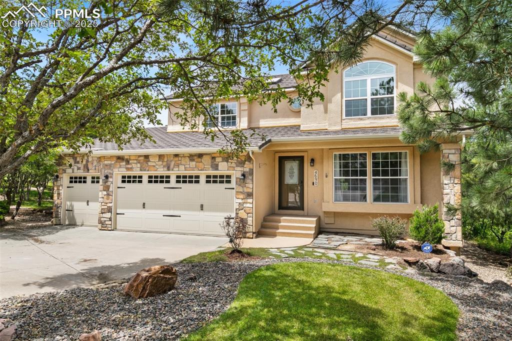 Live in the heart of it all, enjoy this beautifully designed two-story offering upscale comfort in one of the city’s prestigious & vibrant neighborhoods, minutes from shopping, dining, parks & UCCS * From the moment you step inside, you'll be greeted by a warm, inviting & open floor plan, complemented by beautiful wood floors that extend throughout the main level * Bright & airy Living Room boasts a charming window seat, perfect for soaking in the natural light * Adjacent, the formal Dining Room features a large bay window letting the outdoors in, ideal for intimate gatherings or everyday dining * Cook's dream, eat-in Kitchen, complete with solid surface countertops, Stainless Steel appliances, island, pantry & walk-out access to the elevated, newly painted decking, perfect for morning coffee or evening grilling * The adjoining Family Room is anchored by a focal gas fireplace &  includes a versatile attached Office / Sitting Room * Convenient half bath & laundry area complete the main level * Upstairs, the luxurious Primary Suite is a true retreat, featuring vaulted ceilings, huge decorative window, expansive walk-in closet & an elegant 5-piece spa bath * Three additional Bedrooms, one with French Doors and full Bath offer plenty of space for family, friends & guests * Full finished lower level is designed for entertaining with a large Recreation Room / Second Family Room featuring another gas fireplace, plus a spacious Bedroom & convenient ¾ Bath, perfect for multi-generational living or out-of-town visitors * Additional highlights include central air conditioning, built-in speakers thru-out & pre-wiring for a security system * Step outside to a private, landscaped backyard that connects to preserved open space with scenic hiking trails and tranquil Colorado views * Enjoy alfresco living in the outdoor spaces, spacious patio area & charming pergola that creates the perfect oasis * Combining comfort, style, privacy & perfect location in the center of town, WOW...