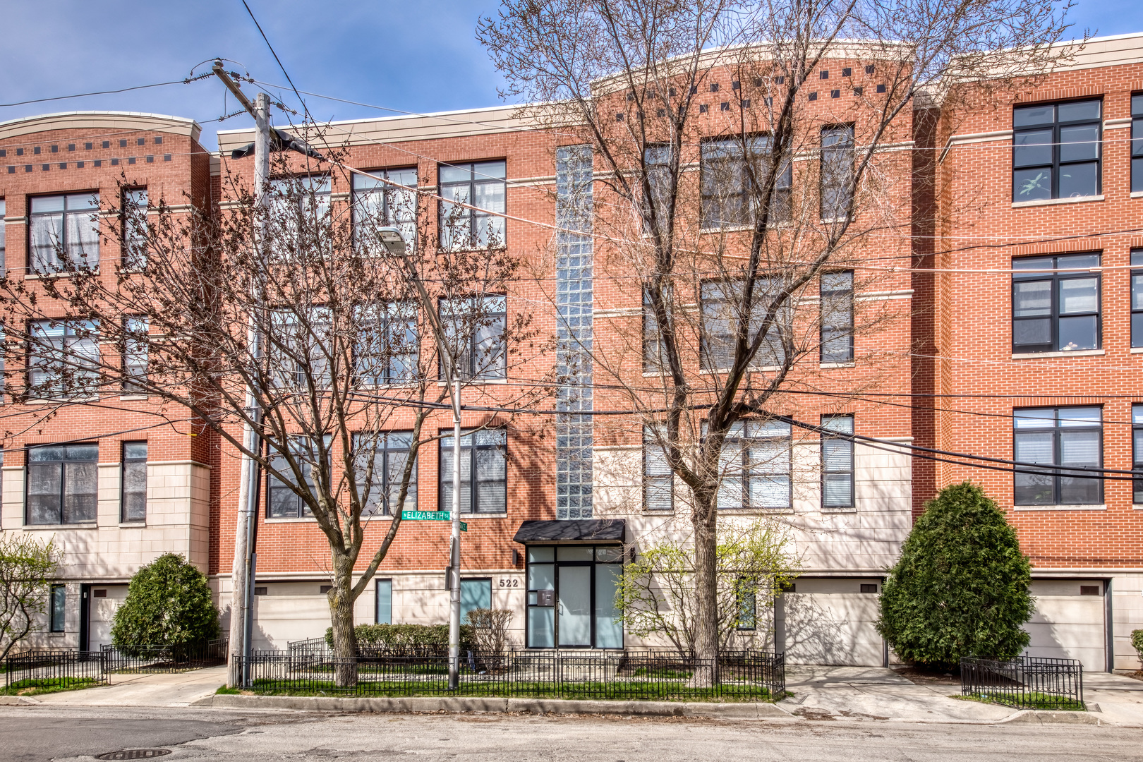 Experience luxury living in this stunning 2-bed/2-bath condo in an elevator building in vibrant West Town! This sun-filled unit has hardwood floors throughout with large windows and a private balcony that spans both bedrooms. The primary bedroom offers a walk in closet and ensuite bathroom with double vanity and jetted tub. The updated kitchen offers top-of-the-line appliances and plenty of cabinet space. The gas fireplace adds warmth to the open concept living and dining room areas. Located in the bustling West Town area, this apartment is just steps away from the best restaurants, cafes, and shopping options in the city. Plus, with easy access to public transportation, you can explore everything the city has to offer within minutes. Additional highlights include in unit laundry, private storage room and 1-car garage parking included in the sale price.