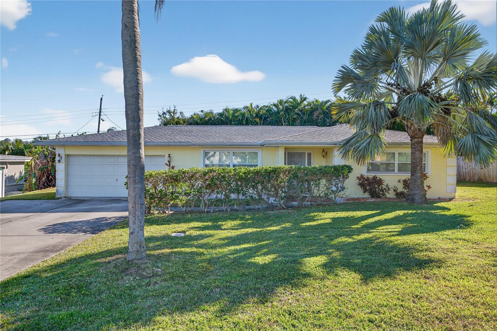 Prime Location, Solid Bones, Unlimited PotentialLocated less than a mile from world-class beaches in unincorporated Largo with no HOA and no rental restrictions, this 2-bed, 2-bath pool home sits on an oversized lot tucked far back off the main road for added privacy. Offering a rare combination of structural integrity and creative freedom, this property is a premier choice for a custom residence or high-end rental.The "heavy lifting" is already complete. All windows and doors are Low E double-pane rated for 185 mph winds. The home features a whole-home generator, an updated electrical panel with expansion capacity, a 2016 roof with a transferable warranty, a newer AC, and a fully re-piped interior. The kitchen was updated in 2013 with custom cabinets, granite countertops, and double ovens.The open-concept layout maximizes natural light and flow, extending seamlessly to the outdoors. The primary suite offers a private bathroom and double closets for ample storage. Practicality meets convenience with a spacious 2-car garage featuring in-garage laundry hookups. The large screened-in lanai provides a comfortable retreat, keeping out mosquitoes and shedding leaves while you enjoy the pool and patio. The oversized lot includes a side yard with significant potential for boat or travel trailer parking, an oversized concrete driveway, and a 10x10' shed wired for electricity. Enjoy the best of the coast with world-class beaches, shopping malls, restaurants, and grocery stores all less than a mile away. Outdoor enthusiasts will appreciate being minutes from the Pinellas Trail and several beautiful local parks.With all major systems modernized, the interior is ready for your personal touch. Update the bathrooms, refresh the paint, and install your choice of flooring to create a space that perfectly reflects your style—or capitalize on the opportunity to add instant equity through strategic cosmetic improvements.Schedule your tour today to see the unlimited potential of this coastal gem