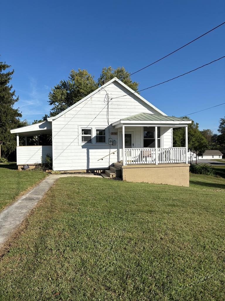 Don't miss out on this delightful 2-bedroom cottage that offers the perfect blend of character and convenience on a spacious .28 acre level lot.  Meticulously maintained and recently updated, this home is truly walk-in ready for its next Owner.  This home offers 2 comfortable bedrooms,(with the possibility of another, refinished hardwood floors, fresh paint, newer windows along with a full unfinished basement with a concrete floor, ideal for storage, workshop space or future finishing potential. Outside you will find a solid cinderblock outbuilding for additional storage, hobbies, or workshop.  There is a brand new back porch and stairs leading to the large level back yard.  Out front is a covered front porch perfect for morning coffee or evening relaxation. This home sits in an unbeatable location with walking distance to grocery stores, Main Street, and shopping stores.  This cottage has been lovingly cared for and updated where it counts. The combination of classic appeal, recent improvements, and an excellent location makes this is rare find in town.  Don't miss this opportunity to own this turnkey home in the heart of it all!