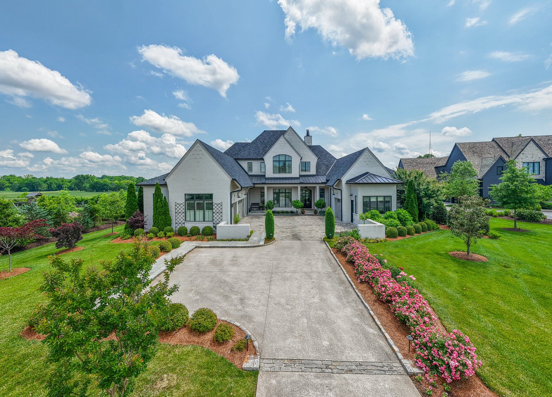 An extraordinary opportunity to seamlessly transition into this private enclave of custom designed homes in the heart of Brentwood. OMAN offers convenience, prestige and privacy with timeless beauty inside & out, modern comforts designed for everyday living all with a scenic view we have come to appreciate in Williamson County. A versatile floor plan with all the amenities & conveniences expected including a designated bar & separate butlers pantry, 2 laundry rooms, wonderful open space for large gatherings & a dreamy outdoor living space complete with a heated in ground pool & hot tub with automatic water leveling feature. The kitchen blends comfort & functionality extending to the covered porch with remote screen for bug-free enjoyment. The primary bath is not only beautiful, it's stunning. A unique Garden Room speaks to those who love to get their hands dirty year round. 3 raised beds out back are ready for you to transfer your favorite herbs & vegetable saplings.
