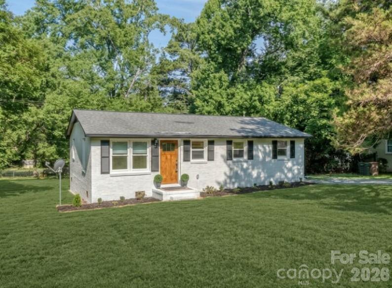 Beautifully updated full brick ranch style home in historic Waxhaw - Two blocks from the Waxhaw community center and park with fields, playground and walking trails - Four blocks to downtown Waxhaw for shopping, dining and entertainment - All the amenities of Charlotte with the charming feel of a smaller town - You won't see the finishes this home has in anything else in this price point - Amazing kitchen with new everything from the cabinets to the appliances - High end quartz countertops and backsplash - Gold finishes and hardware - All new appliances including refrigerator, washer and dryer - Wood flooring throughout home - Primary suite with private bath and walk in tiled shower - Two generous secondary bedrooms share another full bathroom - Window treatments - New roof - New HVAC - New hot water heater - Literally every detail in the home has been carefully sourced and thoughtfully curated for the home - There is nothing left to worry about except moving right in - Large, level lot - Large community area with so much right at your fingertips - Imagine coming home for the weekend and not having to hop back in the car to do anything .. just pop around the corner and enjoy the weekend - Photos do not do the finishes in the home justice and you won't regret your decision to come for a visit - Call anytime for more details or your price showing!