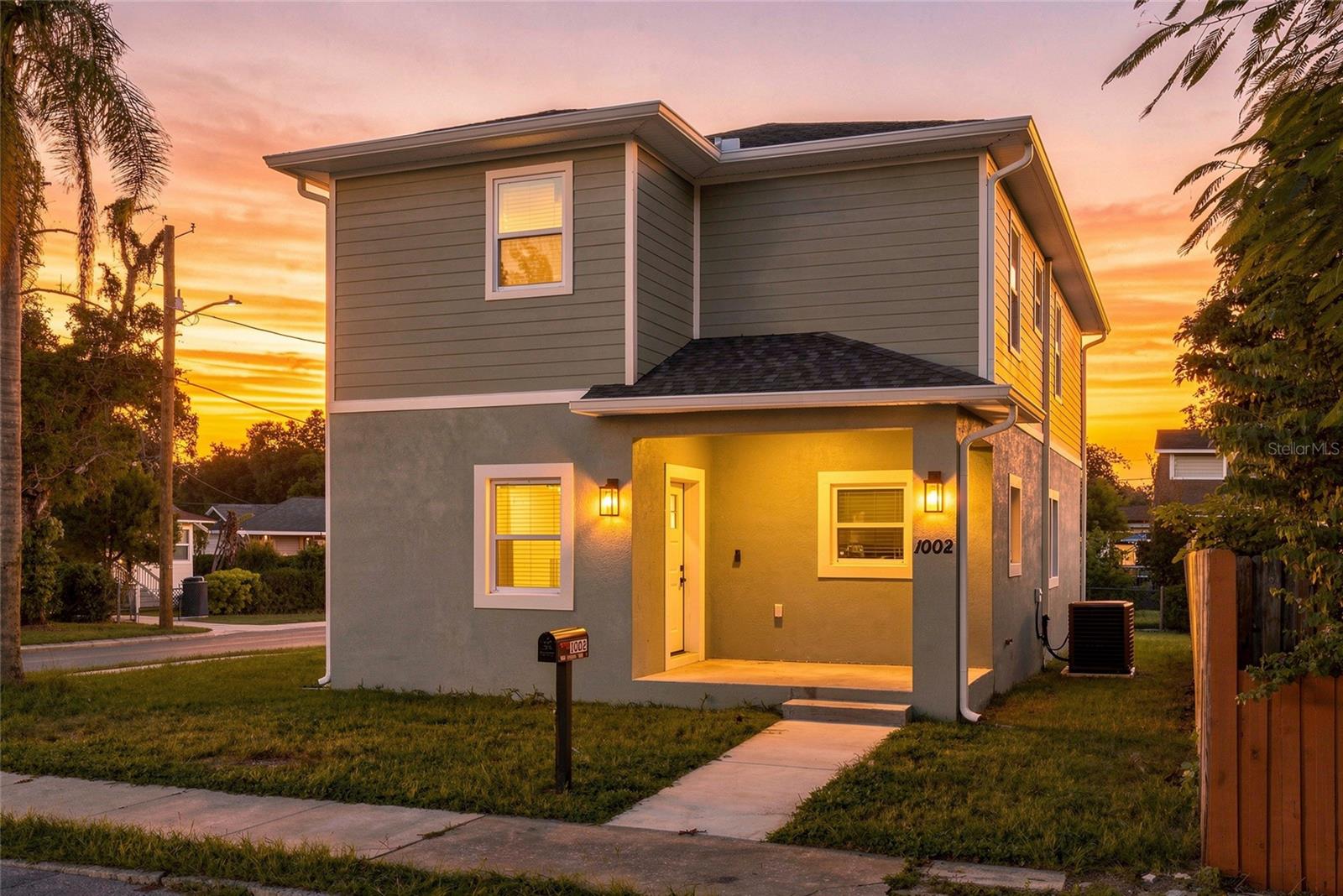 NEW CONSTRUCTION with NO HOA and a GARAGE in Southeast Seminole Heights. Picture pulling into your own garage after a long day, closing the door behind you, and walking into a home no one has ever lived in. This is the ease of condo or townhome living without the monthly association fee, no CDD, and without circling the block for parking. The deep, attached garage has a high ceiling with room for shelving, and a private driveway sits outside. Built with concrete block, impact windows, and located in Flood Zone X, this home was completed in 2026. Inside, 1,646 square feet holds 3 bedrooms and 2.5 baths and a kitchen with shaker cabinets, soft close drawers, a navy island, and a full Samsung appliance package. Granite countertops throughout, luxury vinyl plank, showers tiled to the ceiling, and a 200 amp panel make it completely move-in-ready. The low maintenance corner lot means Saturday mornings are yours: you are minutes to downtown Tampa. Lock and leave living with the privacy of a single family home. Be the first to call it home. Schedule your private showing today.