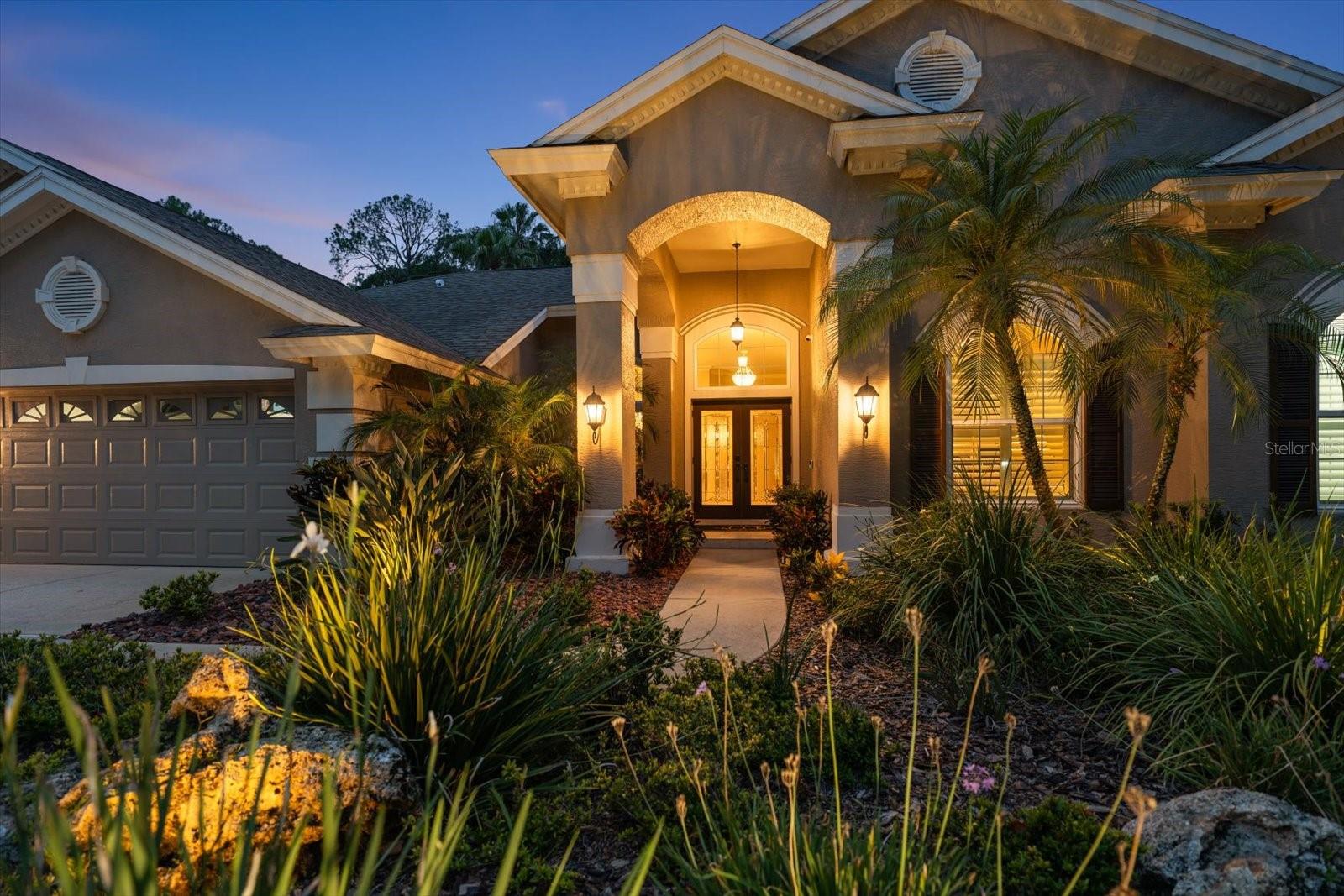 Exceptional Lansbrook Luxury RetreatWelcome to this beautifully updated one owner Arthur Rutenburg home in the highly sought-after Lansbrook community, where luxury, comfort, and resort-style living come together to create the ultimate Florida lifestyle.From the moment you enter, you'll appreciate the home's elegant design, highlighted by a chic dining room chandelier and stunning views of the pool through newly installed hurricane-impact windows. The spacious family room features a cozy wood-burning fireplace, while a large private office provides the perfect space for working from home or managing daily activities.The chef-inspired kitchen is thoughtfully designed with abundant custom cabinetry, granite countertops, and premium appliances, including a double wall oven, cooktop, microwave, dishwasher, and refrigerator. Adjacent to the kitchen, the laundry room includes a washer, dryer, and additional cabinetry, offering ample storage and functionality.The luxurious primary suite serves as a private retreat, featuring dual closets and a beautifully renovated spa-like bathroom complete with a freestanding soaking tub and an expansive walk-in shower. Three additional bedrooms are located on the opposite side of the home, providing privacy and comfort for family members and guests.Step through the hurricane-rated sliding glass doors and discover your own private outdoor oasis. The screened lanai showcases an oversized heated saltwater pool with a sun shelf, creating the perfect setting for relaxation and entertaining. Enjoy your morning coffee beneath the covered veranda as the outdoor gas fireplace adds warmth on cooler mornings.The outdoor living experience continues with a built-in kitchen and grill, ideal for hosting family and friends. Lush tropical landscaping surrounds the pool area, creating a serene and private retreat. As the sun sets, gather beneath the charming tiki hut and enjoy your favorite beverage while taking in the peaceful surroundings.Beyond the home, Lansbrook offers an exceptional lifestyle with access to a private park featuring playgrounds, basketball courts, a gazebo and miles of walking trails.  Owners also enjoy private access to Lake Tarpon for boating and fishing, while being just minutes from world famous Clearwater Beach, Honeymoon Island State Park, the Suncoast YMCA, Tampa International Airport and Professional Football, Baseball and Hockey.Combining elegant interiors, exceptional outdoor living, and an unmatched location, this residence presents a rare opportunity to experience one of the Tampa Bay area's premier communities.
