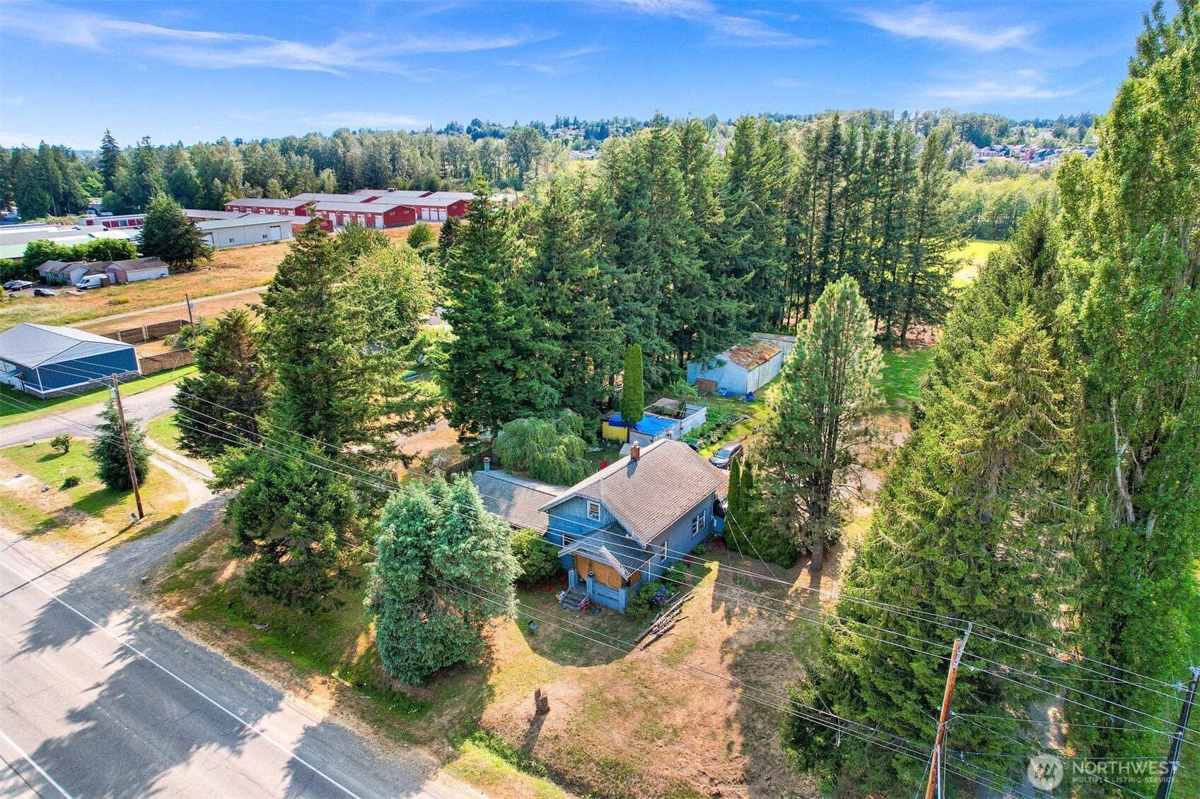 Bring your vision to 1945 Farmhouse on 5.83± acres along Ferndale’s Portal Way corridor! Home is being sold AS-IS, Value in the Land.This unique property combines a vacant 2280± SF residence requiring substantial renovation with nearly six acres of General Business Commercial (GB) zoned land, creating an opportunity well beyond the typical residential property. Reimagine and restore the existing home while enjoying substantial acreage, or explore how the property’s commercial zoning and existing improvements could complement your longer-term plans. The property’s size, Portal Way frontage and convenient access to I-5 may appeal to buyers seeking space for a home, investment, business-related use or future redevelopment. Existing structures provide a starting point while the acreage creates room to consider what comes next. Property and residence are offered in their current condition. An uncommon opportunity to combine a major renovation project with significant land and commercial-zoned real estate in Ferndale. Buyer to verify zoning, permitted uses, utilities, property condition and feasibility of intended use.