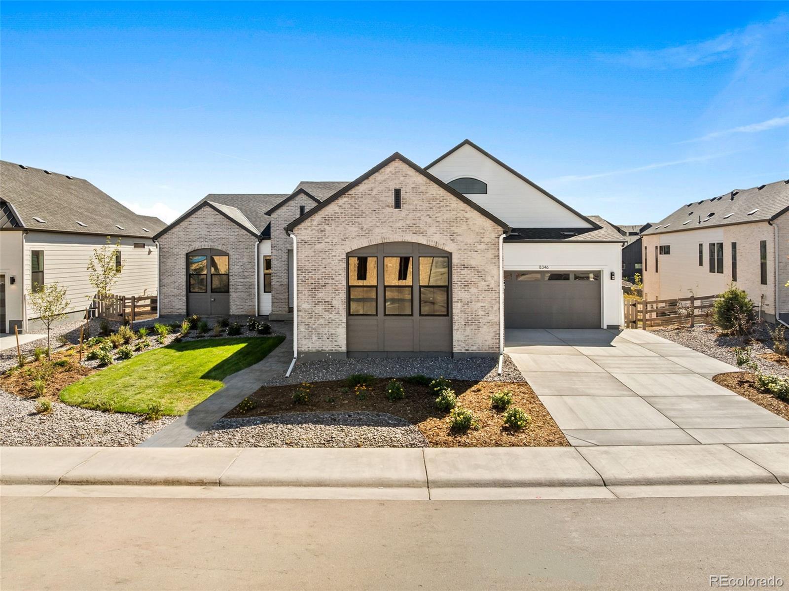 Brand new construction meets elevated living in the iconic Vanderbilt floor plan, a stunning ranch-style home located in The Enclave at Parkvale Village in Sterling Ranch. 8346 Simla Way offers approximately 5,270 finished square feet with 5 bedrooms and 5.5 baths, featuring high-end finishes and thoughtful design throughout. Inside, the open ranch-style floor plan offers soaring ceilings, expansive living spaces, a private office, luxurious primary suite, and beautifully appointed secondary bedrooms. The kitchen features elevated finishes, generous prep space, and a seamless connection to the great room and dining areas, making it ideal for both everyday living and entertaining. Covered outdoor living overlooks the greenbelt and foothills, extending the living space and providing a peaceful backdrop for Colorado living. The finished basement offers amazing flexibility with additional bedrooms and dedicated media, rec party room, wet bar, and fitness spaces. A rare and spacious 4-car garage is also included. Sterling Ranch residents have access to trails, parks, open space, recreation, and a variety of community amenities.