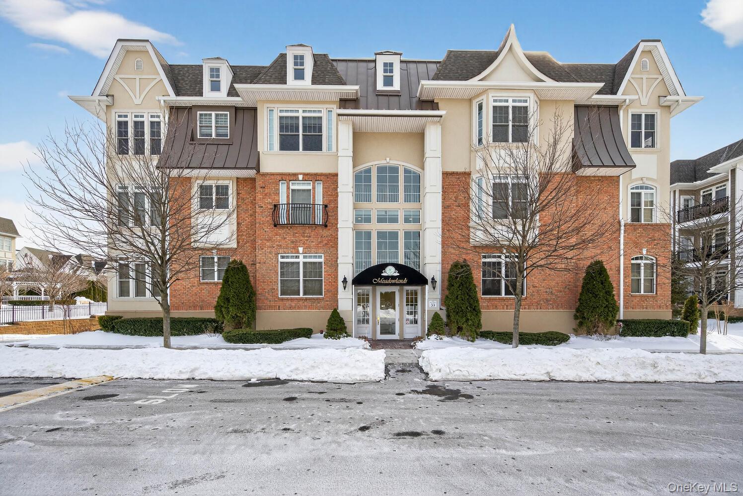 This Spacious and Elegant 2 Bed/2 Bath Bradford Unit is in Diamond Condition and has Showroom Quality! From the Moment you Enter you are Greeted by the Warmth of the Impeccable Decor, including the White Kitchen Cabinets, Stainless Steel Appliances, Gleaming Hardwood Floors, and Granite Countertops! The Large Primary Bedroom Ensuite has a Walk-In Closet, Double Sinks, and Custom Marble Tile. The 2nd Bedroom comes Complete with a Custom Murphy Bed and "Jack and Jill" Access to the 2nd Full Bath. An Outdoor Covered Balcony Overlooks the Serene Evergreen Trees and Gardens. Amenities Galore Include Tray Ceilings, In-Unit Laundry Room, Designated Underground Parking, 2 Storage Bins, and a Storage Cage. The 25,000 Sq Ft Clubhouse Has Indoor and Outdoor Pools, a Fitness Center, Billiard & Card Rms, Bar, Ballroom, Library, Theatre, Spa, Salon, Cafe and More! Outdoor Tennis & Bocce Ball Courts are only Some of the Amazing Amenities you'll Enjoy from Resort-Style Living at Meadowbrook Pointe!