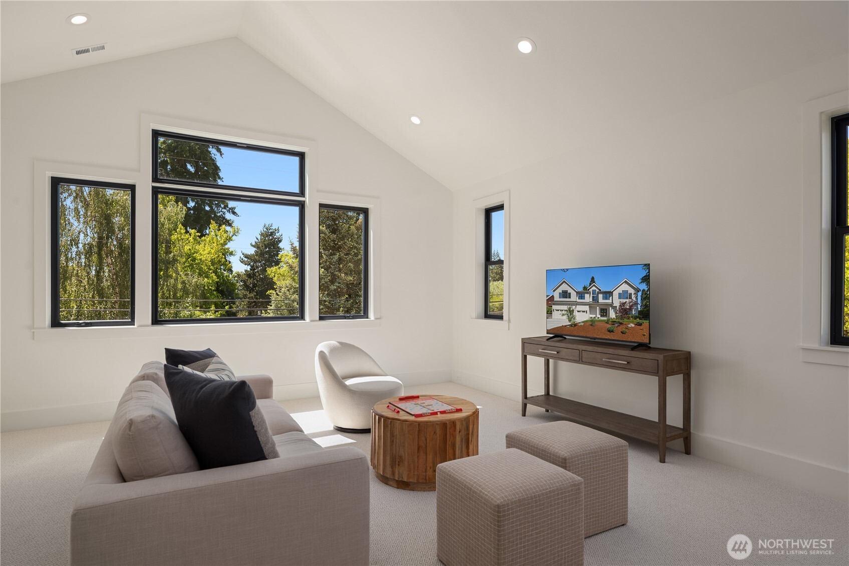 Upstairs bonus room offers flexible space for movies or play