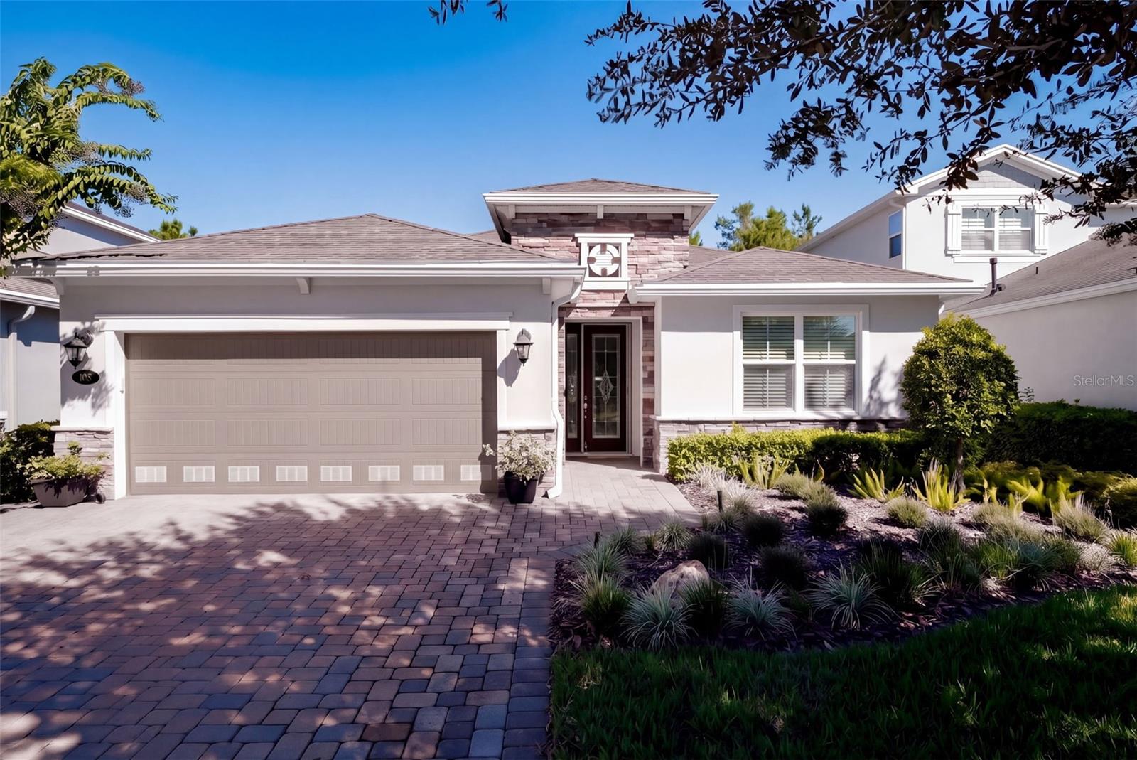 Light & Bright 2018 built Kolter Lily with a wooded view, 23’ garage depth & a 24’ x 22’ screen enclosed covered lanai within the 55+ Victoria Gardens neighborhood. This 2 Bedroom 2 Bath plus Den floorplan has a GREAT ROOM layout. The gourmet kitchen is a chef’s dream that offers 42” Cherry cabinets w/ under cabinet lighting, Listello tile backsplash, crown molding, Pot & Pan drawers, Granite countertops, large breakfast island w/ pendant lighting above, 5-burner natural gas convection range, walk-in pantry & stainless-steel appliances. Porcelain tile & luxury vinyl flooring flow throughout the majority of the home. Personalized features include leaded glass front entry door, sliding screen at front entry, recessed lighting, crown molding, 5” baseboards, Plantation style shutters, remote shades for sliding glass doors, whole home water softener & a 5-burner natural gas convection range. The 14’ x 17’ primary bedroom offers a tray ceiling, ceiling fan, Plantation style shutters, luxury vinyl flooring & a wooded view. En suite bathroom provides raised height separate vanities, glass enclosed walk-in shower, bench seat & a 14’ x 5’6” walk-in closet. Homeowner will enjoy having their morning coffee or late afternoon beverage on the large screen enclosed covered lanai w/ an awning, a natural gas connection for an outdoor grill, wall mounted TV, aluminum rail fenced backyard & a wooded view. The 19’ x 23’ garage gives additional space for larger vehicles or a work bench, epoxy floor coating, ceiling mounted storage racks, exhaust fans to increase ventilation & additional lighting. Utility room comes with a laundry tub, washer, natural gas dryer & storage shelving. All appliances stay with the home. Victoria Garden residents have access to their own social Private Clubhouse. HOA fee includes lawn care, Spectrum HFC TV & internet and reclaimed water for yard irrigation. Community is within 1 mile of I-4 that offers great access to the east coast beaches, Orlando (40 minutes) and 3 International airports within 1 hour.