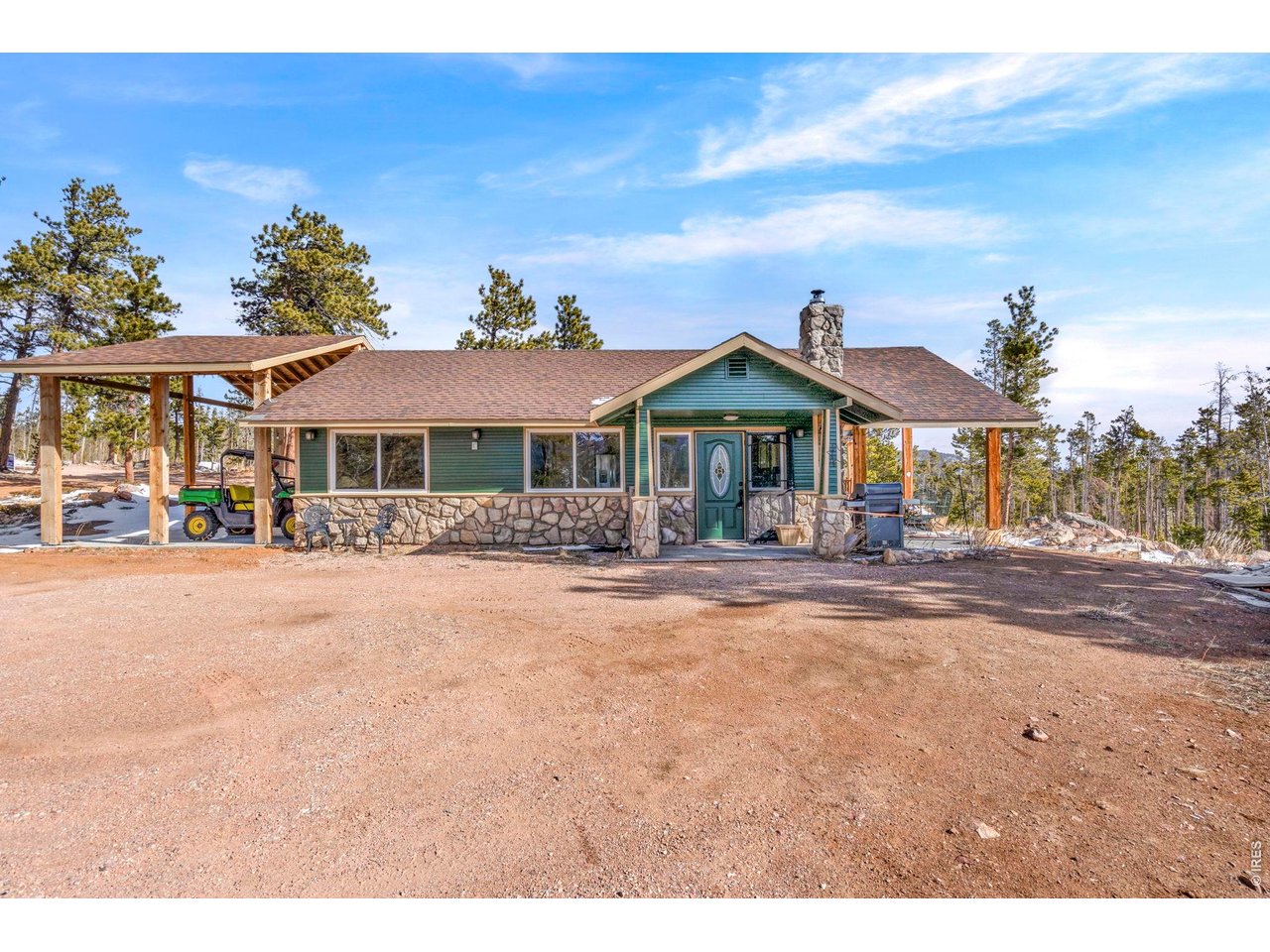 The mountains are calling!! Welcome to 104 Atakapa Ct. Nestled off the end of the road and overlooking Beaver Meadows to the South, this updated 2 bed 1 bath cabin on 3.53 acres has got it all. The lot is simultaneously beautifully forested while also open for ample parking and/or play areas and boasts some truly incredible views. The cabin interior is both fully updated and beautifully and meticulously finished in knotty pine making it the warm and rustic retreat we all crave. For the city-dweller in some of us there are also a plethora of added necessities: lovely kitchen, heated bathroom floor, a well for water, a newer septic system with leach field, electric heat, double pane windows, separate laundry room with washer and dryer, and beautiful lighting. The wood stove is a great bonus for an additional or backup heat source on those extra cold days. The cabin exterior (freshly repainted February 2026) has two large and covered patios; one on the East side and one on the West. The covered and Trex-decked East patio's expansive views overlook the forest, snow-capped ranges and the darling little rustic tree house. The covered and concrete-floored West patio provides additional and ample outdoor space for BBQ's, games, relaxing, or can also serve as covered parking. To top it all off behind the cabin is a large storage shed to keep your toys and tools safe. Answer the call, schedule your showing today!!