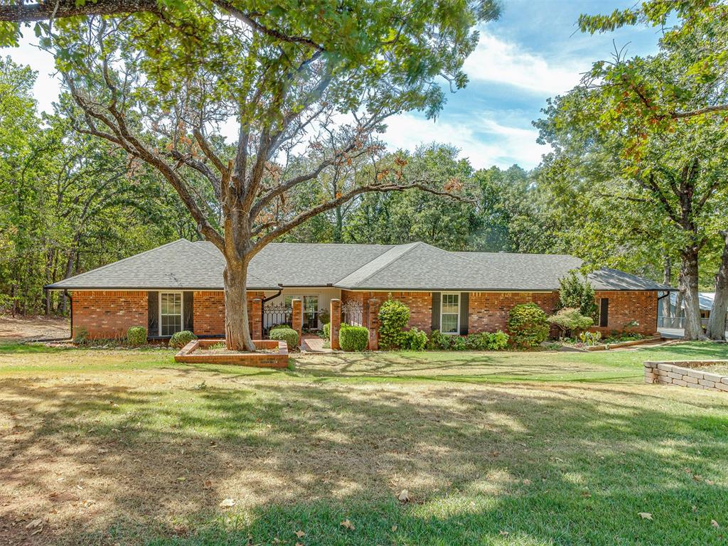 Discover a standout Norman retreat just minutes from the OU campus and Lake Thunderbird, where mature trees and a stocked pond create an inviting setting to unwind and enjoy the outdoors. A welcoming fireplace and sun-filled sunroom bring warmth and character to the home, while the backyard features an in-ground pool with a liner replaced in summer 2023, plus a hot tub installed in 2022. Two large shops, both equipped with electricity, provide room for hobbies, projects, and storage, complementing outdoor spaces made for relaxing and entertaining. Major improvements include a new roof installed in September 2026, heating and air conditioning replaced in 2023, and home plumbing and septic lines replaced in 2025, combining appealing amenities with substantial recent updates.